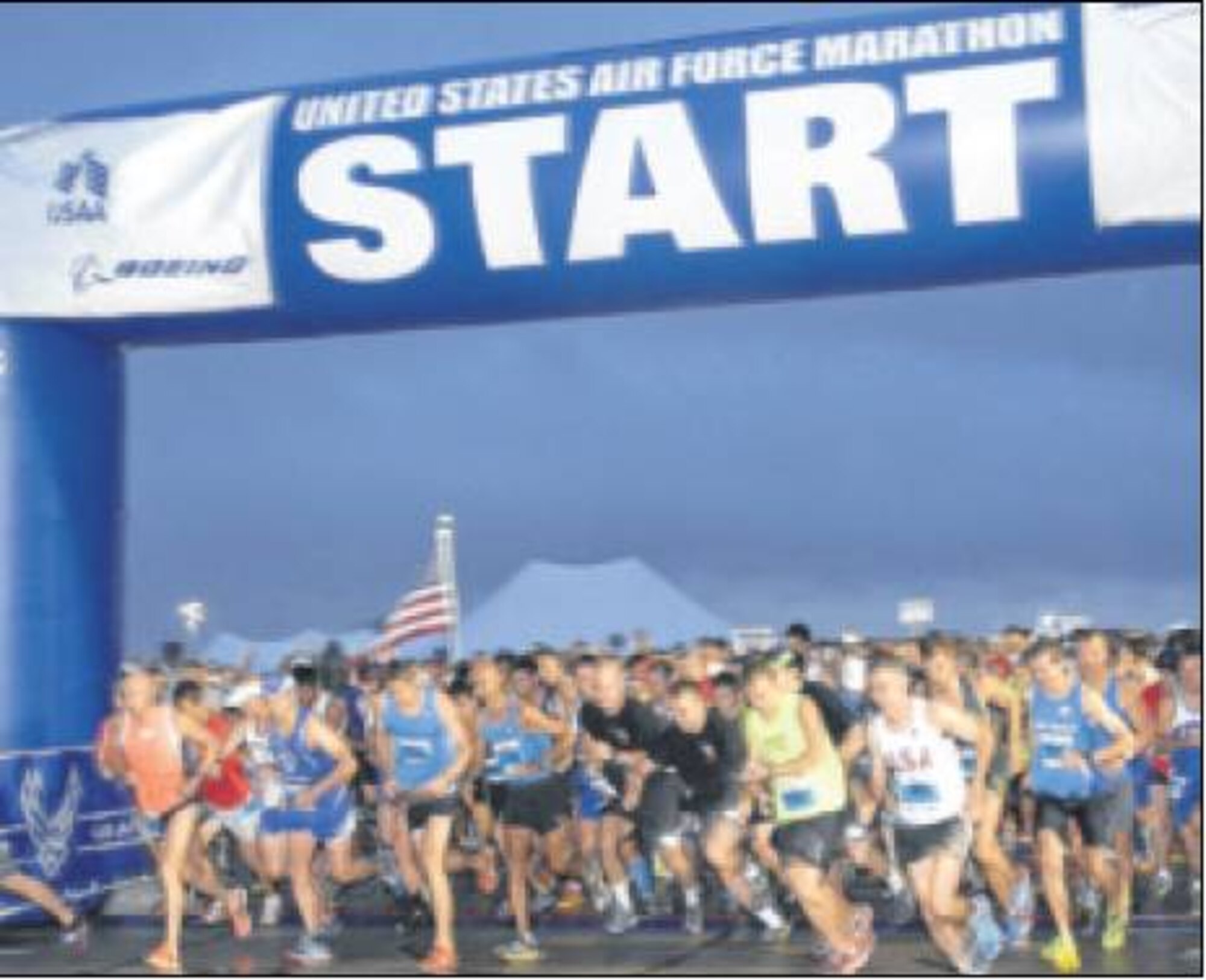 Runners take off from the starting gate at the 2013 Air Force Marathon. (Air Force photo) 