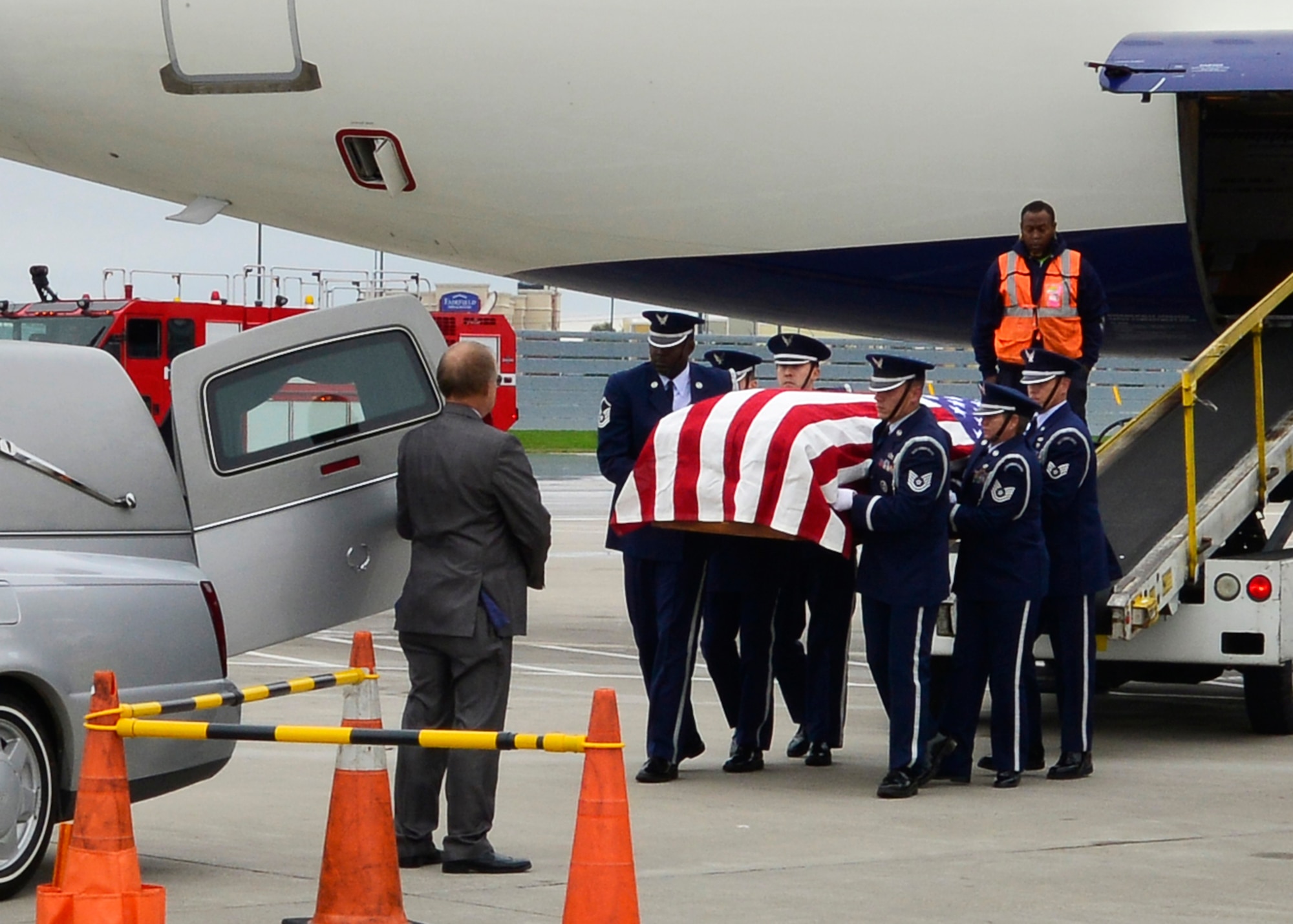 The Niagara Falls Air Reserve Station Honor Guard conducts a dignified arrival of U.S. Air Force 1st Lt. William Irving Turner at the Buffalo Niagara International Airport, Buffalo, N.Y., September 18, 2014. Irving was onboard a C-124 Globemaster aircraft that crashed on Nov. 22, 1952, while en route to Elmendorf Air Force Base, Alaska, from McChord Air Force Base, Wa. A military escort remained with Turner to his hometown of Coudersport, Pa. (U.S. Air Force photo by Staff Sgt. Stephanie Sawyer)