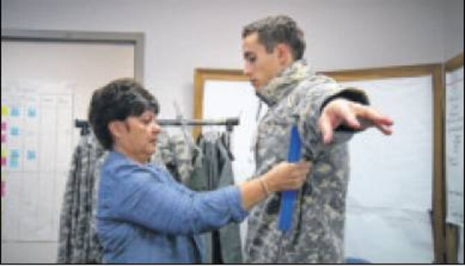 Tracy Roan, a clothing designer in the Air Force Uniform Office, fit tests an Airman trying on the new Cold Weather Aviation System. The request is to develop a flame resistant system that can also keep aircrews warm in minus 20 degree temperatures with a 55 mph wind. (Air Force photos by Matthew Clouse) 
