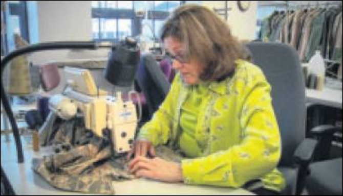 Debra Klensch sews pockets on an Airman Battle Uniform. Klensch is a clothing designer in the Air Force Uniform Office. (Air Force photos by Matthew Clouse) 