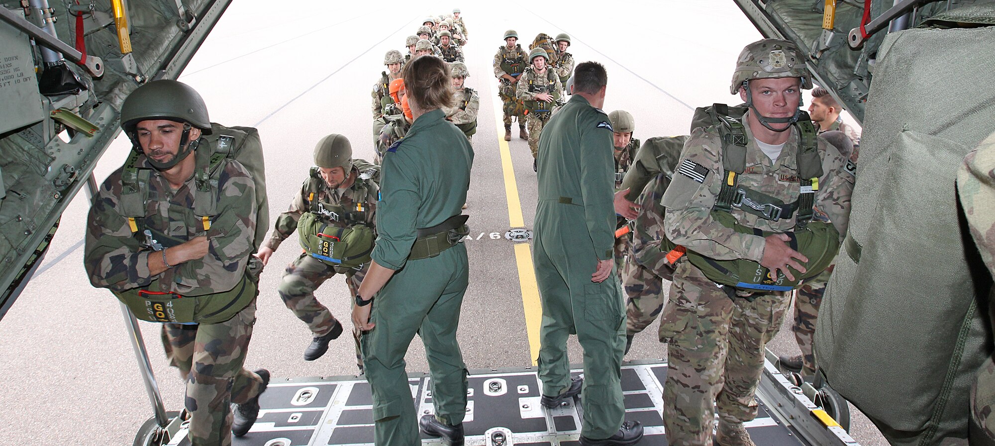 The force protection specialists of the 823rd Base Defense Squadron and Commando Parachutiste De l’Air No. 20 board a Royal Air Force 47 Squadron C-130J Hercules at RAF Brize Norton, England, Sept. 11.The force protection specialists concluded Exercise Global Eagle with a combined jump, and earned a set of British Military Parachute Wings. 

This year, for the first time, force protection specialists from three different nations came together for two weeks to train and exchange tactics, techniques and procedures on a variety of defense capabilities, including hand-to-hand combat, land navigation and weapons familiarization. Exercise Global Eagle is an annual exercise conducted on U.S. Air Force and RAF installations on alternating years.  (Royal Air Force courtesy photo by Cpl. Barbara Robinson/Released)

