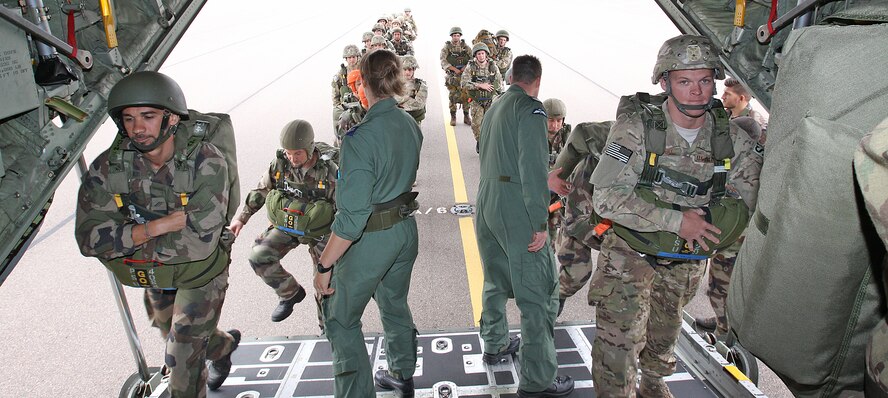 The force protection specialists of the 823rd Base Defense Squadron and Commando Parachutiste De l’Air No. 20 board a Royal Air Force 47 Squadron C-130J Hercules at RAF Brize Norton, England, Sept. 11.The force protection specialists concluded Exercise Global Eagle with a combined jump, and earned a set of British Military Parachute Wings. 

This year, for the first time, force protection specialists from three different nations came together for two weeks to train and exchange tactics, techniques and procedures on a variety of defense capabilities, including hand-to-hand combat, land navigation and weapons familiarization. Exercise Global Eagle is an annual exercise conducted on U.S. Air Force and RAF installations on alternating years.  (Royal Air Force courtesy photo by Cpl. Barbara Robinson/Released)


