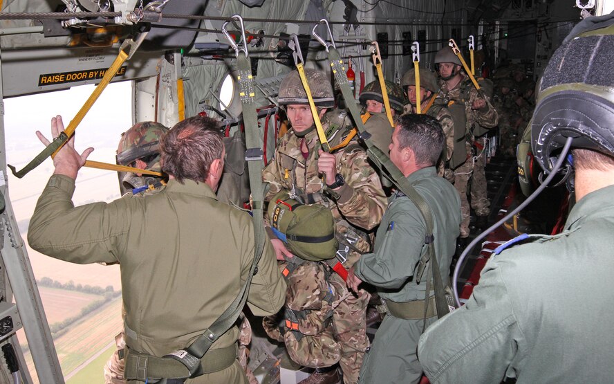 U.S. Air Force Capt. Shawn Chamberlin, II Squadron, Royal Air Force Regiment Headquarters Flight officer commanding, prepares to step out of a RAF C-130J Hercules during a combat equipment jump over RAF Brize Norton, England, Sept. 11. Chamberlin is a U.S. exchange officer serving with the RAF Regiment. (Royal Air Force courtesy photo by Cpl. Barbara Robinson/Released)