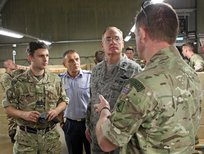 Group Captain Scott Miller (far right), Royal Air Force Regiment commander, briefs Brig. Gen. Doug Cox, U.S. Air Forces Europe – United Kingdom director, and Wing Commander Phil Nicholson, senior Royal Air Force liaison officer to USAFE-UK, on the close-quarters battle drills executed by the U.S., British and French Airmen during Exercise Global Eagle Sept. 5 at the Force Protection Centre at RAF Honington, England. Flight Lt. Tom Campbell (far left), deputy training squadron commander, provided additional background information on the Force Protection Center capabilities. Cox and Nicholson took the opportunity to observe the training operation and witness the tri-nation tactics, techniques and procedures exchange. (Royal Air Force courtesy photo by Cpl. Barbara Robinson/Released)