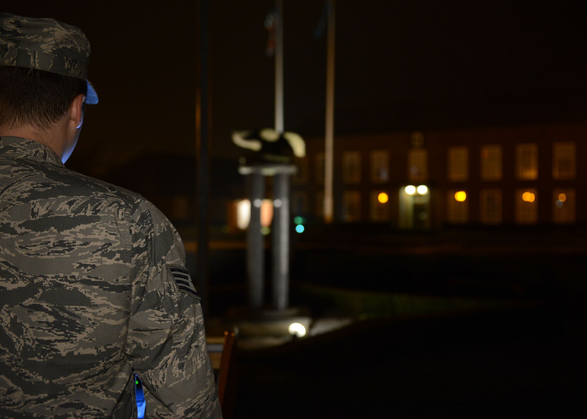 U.S. Air Force Staff Sgt. Mathew Casey, 352nd Special Operations Maintenance Squadron Consolidated Tool Kit shift lead from Tulsa, Okla., reads names Sept. 19, 2014, as part of a 24-hour vigil on RAF Mildenhall, England. Team Mildenhall members continually rotated reading names and standing guard at the POW/MIA monument for 24 hours to honor those who were captured or lost. (U.S. Air Force photo/Airman 1st Class Preston Webb/Released)