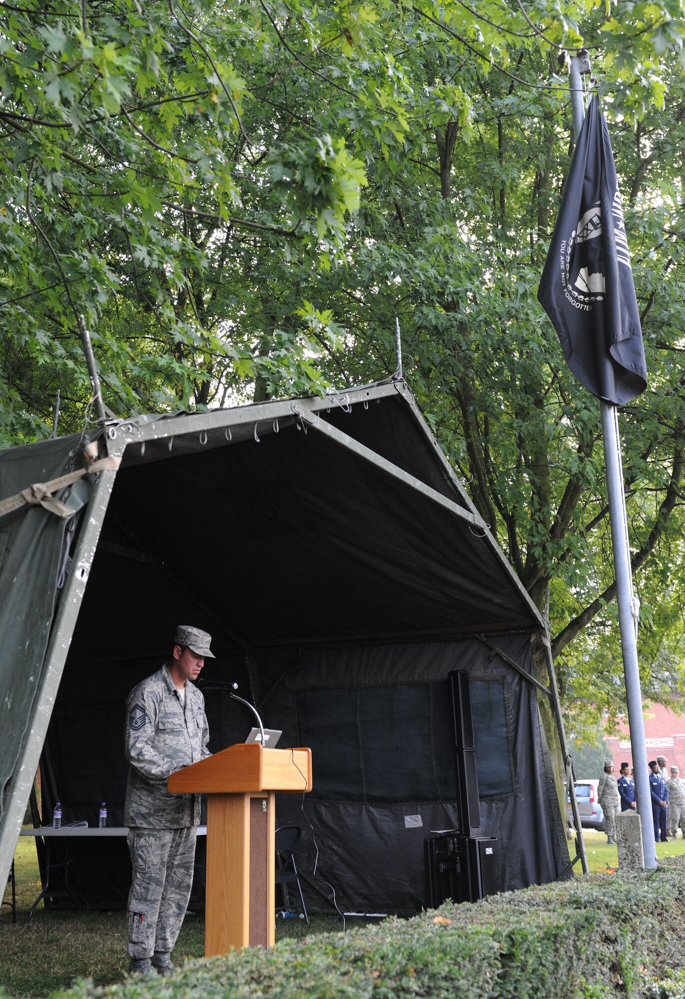 U.S. Air Force Senior Master Sgt. Ronald Garbarini, 95th Reconnaissance Squadron maintenance superintendent from Boonton, N.J., reads the names of prisoners of war/missing in action during a 24-hour vigil Sept. 19, 2014, on RAF Mildenhall, England. Every year the base hosts a vigil where volunteers read names before standing guard in front of a POW/MIA memorial as part of the annual POW/MIA Remembrance Week. (U.S. Air Force photo/Senior Airman Kate Maurer/Released) 
