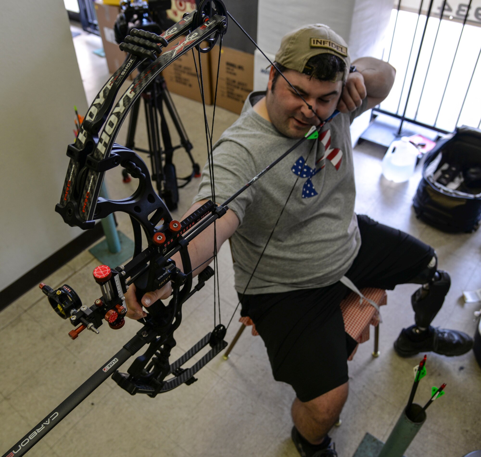 U.S. Air Force Staff Sgt. Seth Pena, a former tactical control air party member currently with the 59th Medical Wing's Airman Medical Transition Unit, aims his compound bow at a target Sept. 12, 2014 at a local archery facility in San Antonio. Seriously injured by a drunk driver, Pena is now vying for a spot on the Air Force archery team competing at the 2014 Warrior Games Sept. 28 through Oct. 4, 2014, in Colorado Springs, Colorado. (U.S. Air Force photo/Senior Airman Michael Ellis)