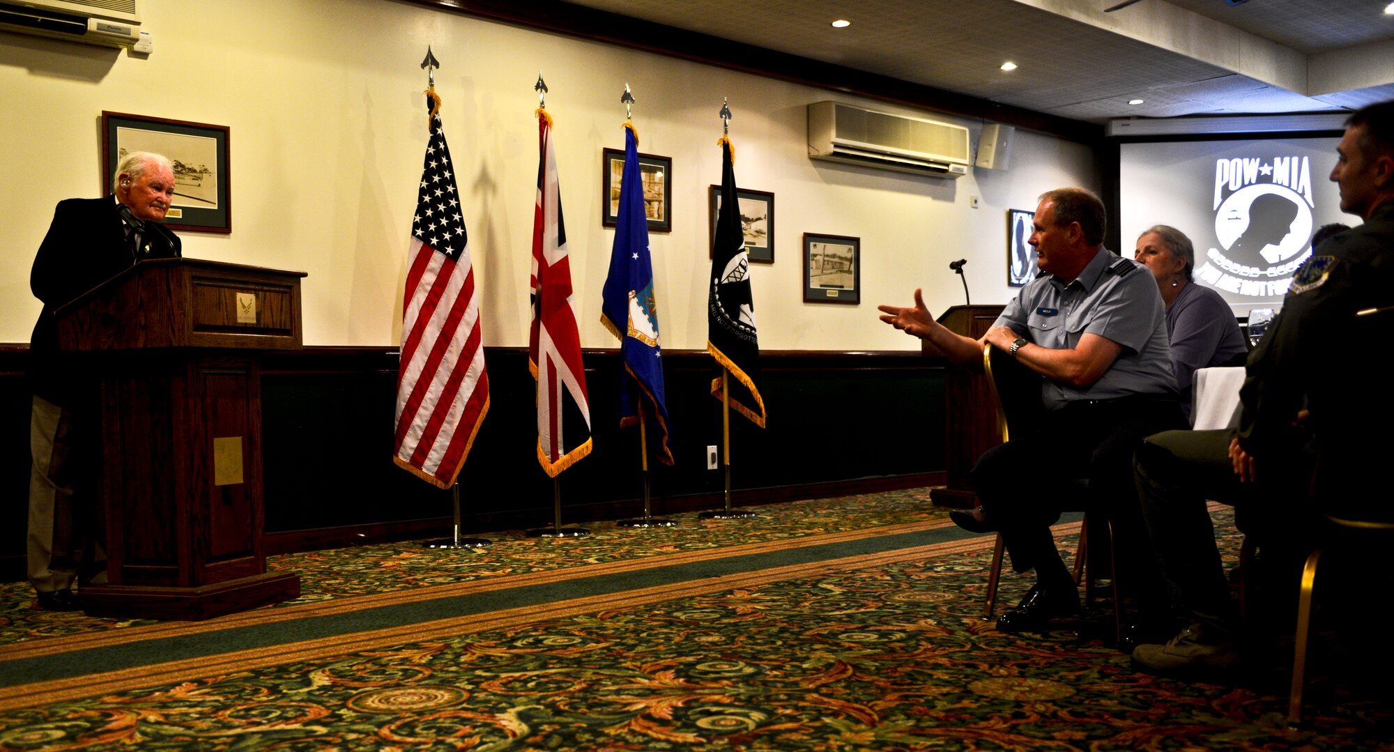 Former Royal Air Force Warrant Officer Norman Gregory fields a question from Squadron Leader Jerry Neild, RAF commander at RAF Lakenheath during the POW/MIA Recognition Luncheon, Sept. 19, 2014. Gregory was one of three crew members to survive when their Lancaster bomber was shot down during a raid on Dortmund, Germany, May 22, 1944. (U.S. Air Force photo by Airman 1st Class Erin R. Babis/Released)