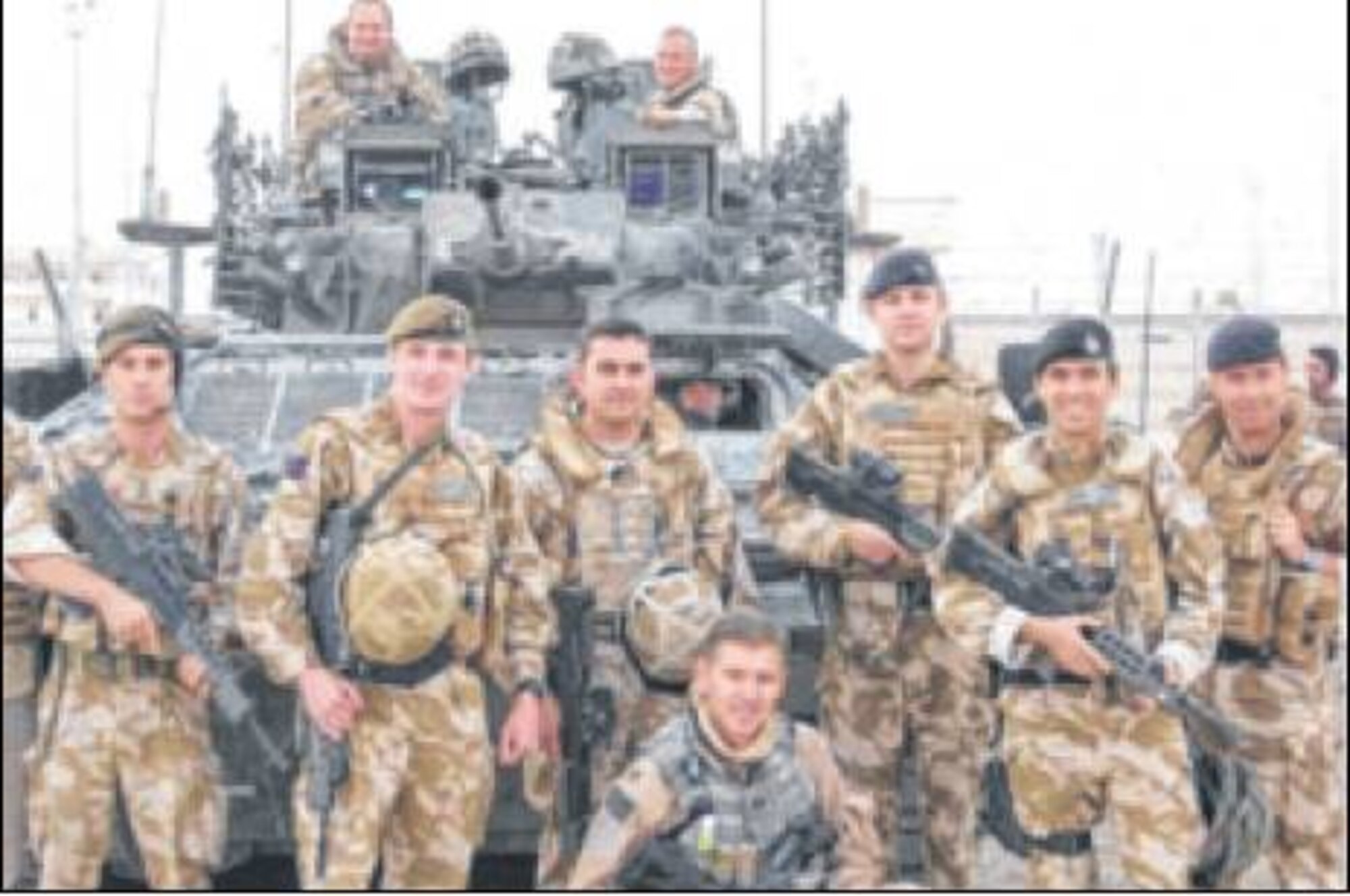 As an Air Force combat logistics advisor embedded with the Royal Dragoon Guards, O'Sullivan (crouching in front) mentored and trained the Iraqi Army 14th Division. He was traveling in a British armored vehicle when an 80-lb. improvised explosively formed projectile hit, causing a traumatic brain injury. The Purple Heart recipient had to take medical retirement but continues to prove his resillience as he serves now at Wright-Patterson AFB as an instructor. (photo by Amy Rollins)
