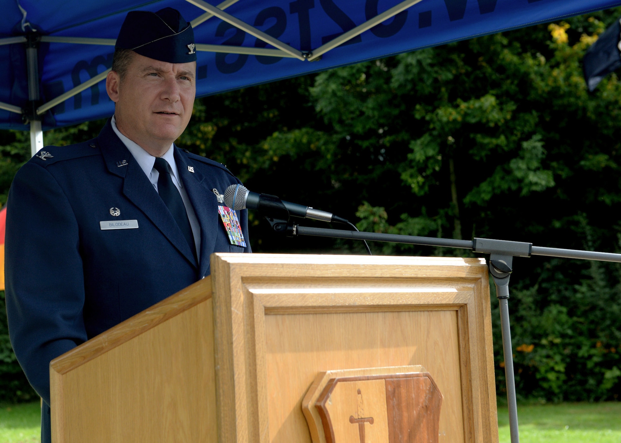 U.S. Air Force Col. Pete Bilodeau, 52nd Fighter Wing commander, speaks at the POW/MIA ceremony at the Air Park on Spangdahlem Air Base, Germany, Sept. 19, 2014. Bilodeau gave a speech about U.S. military efforts to recover the remains of fallen heroes around the world at various war sites in order to bring them back home. (U.S. Air Force photo by Airman 1st Class Timothy Kim/Released)