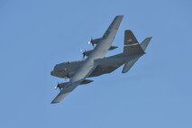 A Kentucky Air National Guard C-130 banks over Groesbeek, Netherlands, Sept. 18, 2014, after deploying U.S., British, Dutch and Polish paratroopers as part of the 70th-anniversary re-enactment of Operation Market Garden. The historic World War II mission was, at the time, the largest airborne assault ever conducted. (U.S. Air National Guard photo by Master Sgt. Charles Delano)