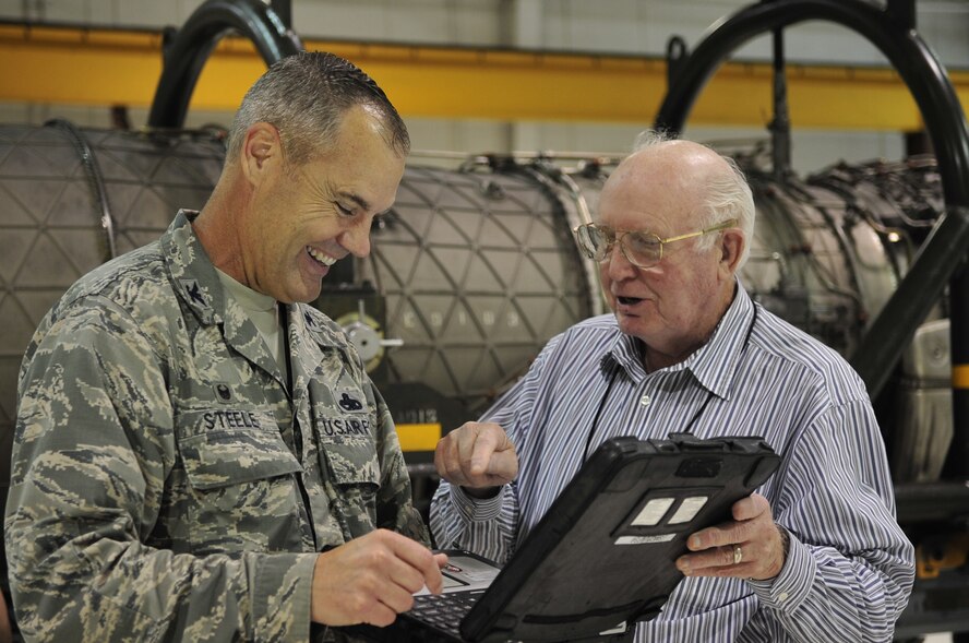 Col. Darrell Steele, 4th Maintenance Group commander, discusses the technological advancements in aircraft maintenance with a Korean War veteran during the 4th Fighter Interceptor Wing reunion at Seymour Johnson Air Force Base, North Carolina Sept. 12. Veterans, who were assigned to the 4th FIW during the Korean War, toured much of the base and held several functions Sept. 11-13. (U.S. Air Force photo/Airman 1st Class Shawna Keyes)