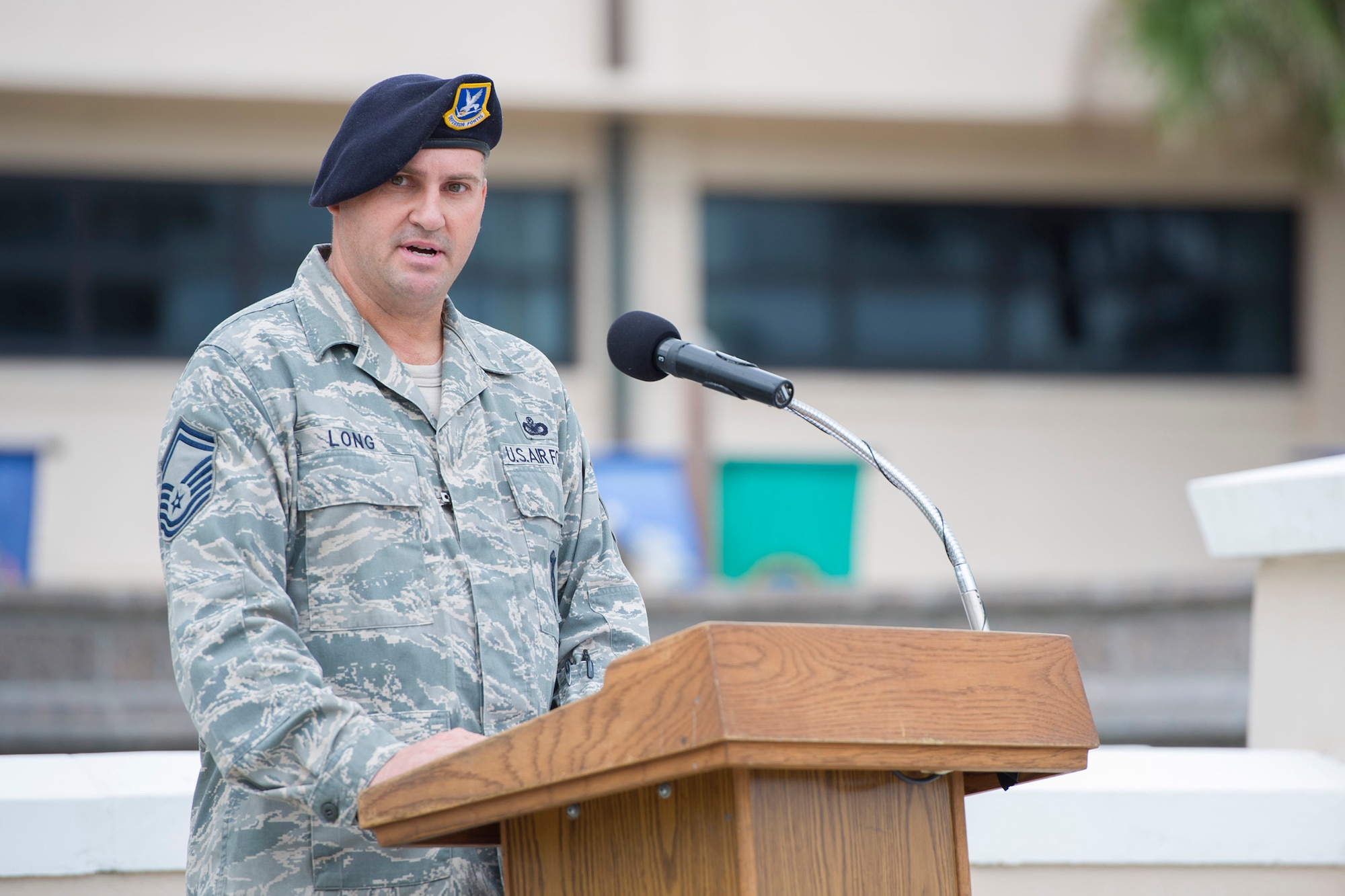 Senior Master Sgt. Keith Long, 45th Security Forces Squadron operations superintendent and the ceremony’s emcee, addresses Team Patrick-Cape during the POW/MIA remembrance ceremony, Sept. 19, 2014 at Patrick Air Force Base, Fla. Members of Team Patrick-Cape attended a POW/MIA remembrance ceremony honoring those who paid the ultimate sacrifice. (U.S. Air Force photo/Matthew Jurgens/Released)