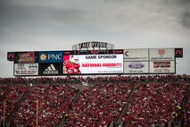 The University of Louisville honors servicemembers during the U of L-Murray State football game at Papa John's Cardinal Stadium in Louisville, Ky., Sept. 6, 2014. The game, billed as Military Appreciation Day, started with a coin toss executed by Air Force Brig. Gen. Warren Hurst, the Kentucky National Guard's assistant adjutant general for Air and commander of the Kentucky Air National Guard. Recruiters from the Kentucky Army and Air Guard also set up booths featuring displays of military equipment and answered questions posed by hundreds of fans. (U.S. Air National Guard photo by Maj. Dale Greer/Released)