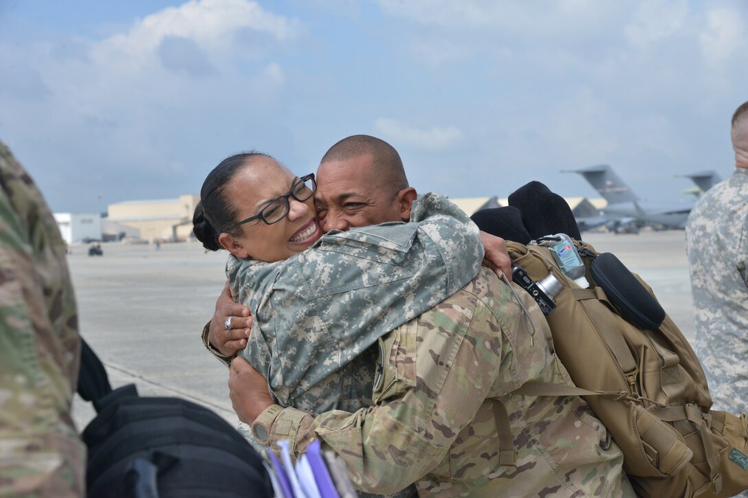 About 200 soldiers with the Army National Guard’s 48th Brigade Infantry Combat Team were greeted by Team Robins members upon their return from Afghanistan September 16, 2014. The unit’s arrival concludes a nine-month deployment in which soldiers provided base operations support, security, training and force protection. The 48th Brigade, commanded by Col. Randall Simmons and Command Sgt. Maj. Shawn Lewis, led some of the largest and most complex transfers of installations to date. (U.S. Air Force photo by Ray Crayton)
