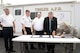 Col. Lea Kirkwood, 72nd Air Base Wing vice commander, right, signs a Memorandum of Understanding  between Tinker, Midwest City and Del City, on Sept. 10 at the Reed Center. Also signing the MOU for Tinker’s Mobile Command Post to serve the three communities are, from left, Assistant Chief Glen Brown of the Midwest City Fire Department; Terry Ford, chief of Tinker Fire and Emergency Services; Jim Hock, chief of the Del City Fire Department; and Midwest City Mayor Jack Fry. (Air Force photo by Kelly White)