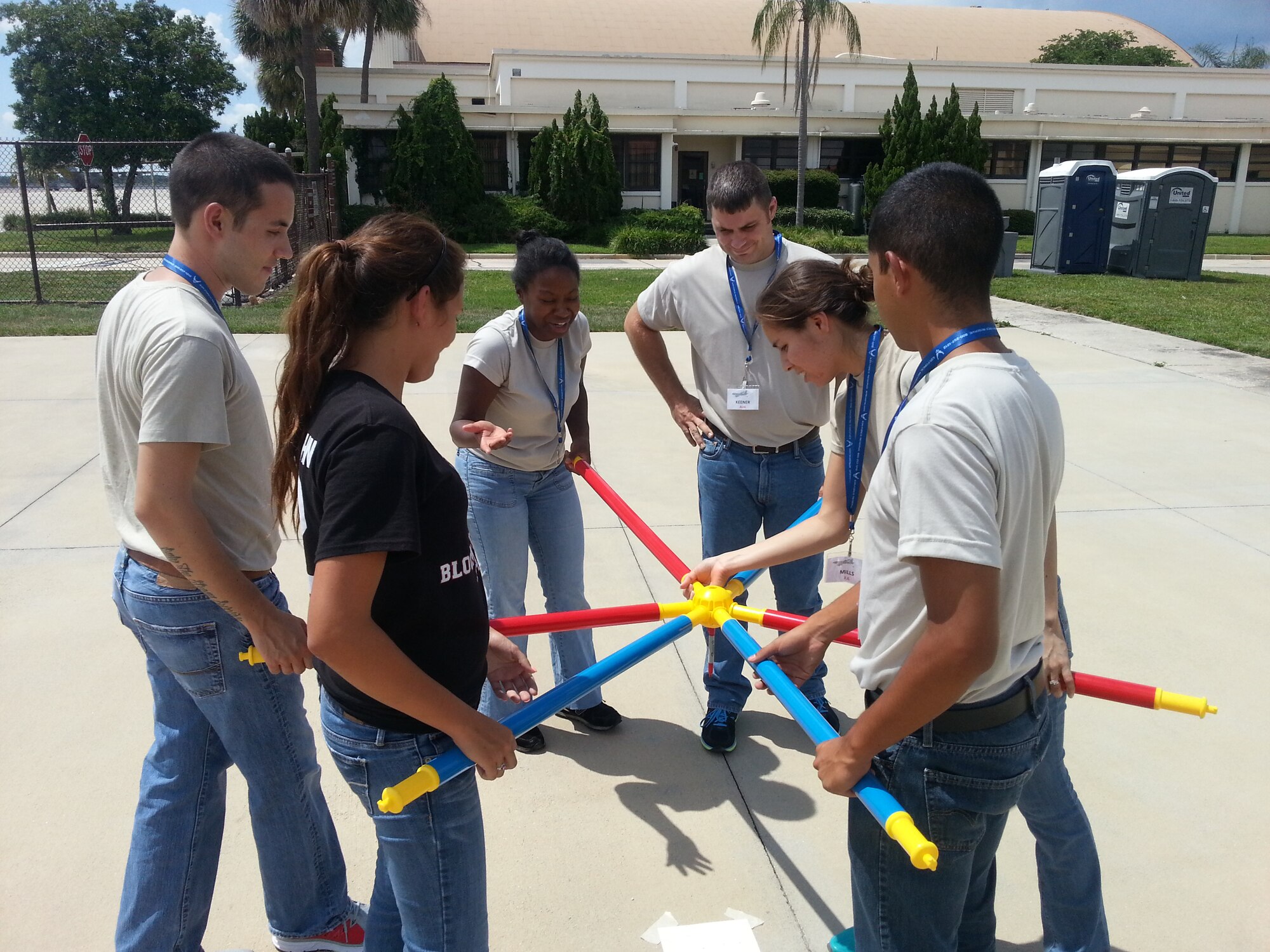 Six trainees assigned to the 927th Air Refueling Wing Developmental and Training Flight participates in a team building activity in preparation for Basic Military Training during a unit training assembly at MacDill Air Force Base August 2, 2014. Working as a team can sometimes be difficult in BMT, the DTF program teaches trainees different tecniques to effectively work together. (U.S. Air Force Photo/Released)
