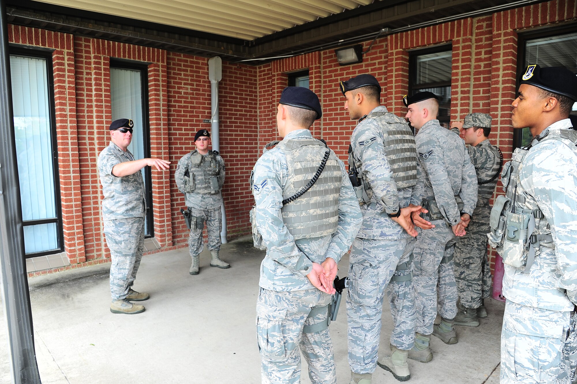 Col. Michael Allshouse, Air Education and Training Command A7S Chief of Security Forces, and Master Sgt. Jason Seibel, A7S Command Integrated Defense Manager, speak to Columbus Air Force Base defenders Sept. 17 during a guardmount. Allshouse and Seibel spent two days speaking with Airmen and touring Columbus AFB. (U.S. Air Force photo/Elizabeth Owens)