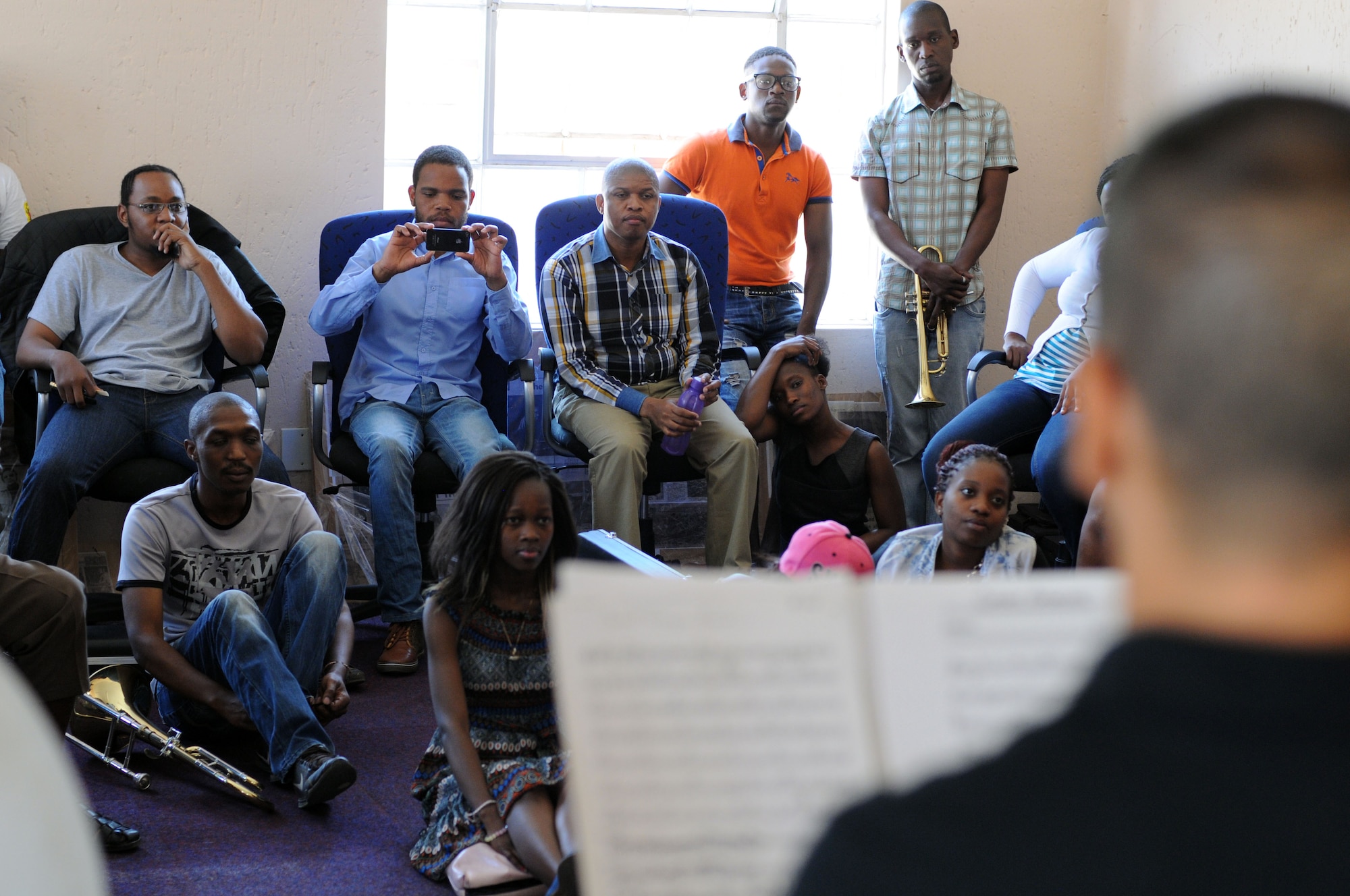South African music students listen learn about music techniques from members of the U.S. Air Forces in Europe jazz band, Wings of Dixie, during a workshop prior to a free, live concert at the Music Academy of Gauteng in Benoni, South Africa, Sept 18, 2014. Wings of Dixie played a two-hour musical set featuring the musical styles of jazz, funk and blues. (U.S. Air Force photo/Tech. Sgt. Austin M. May/Released)