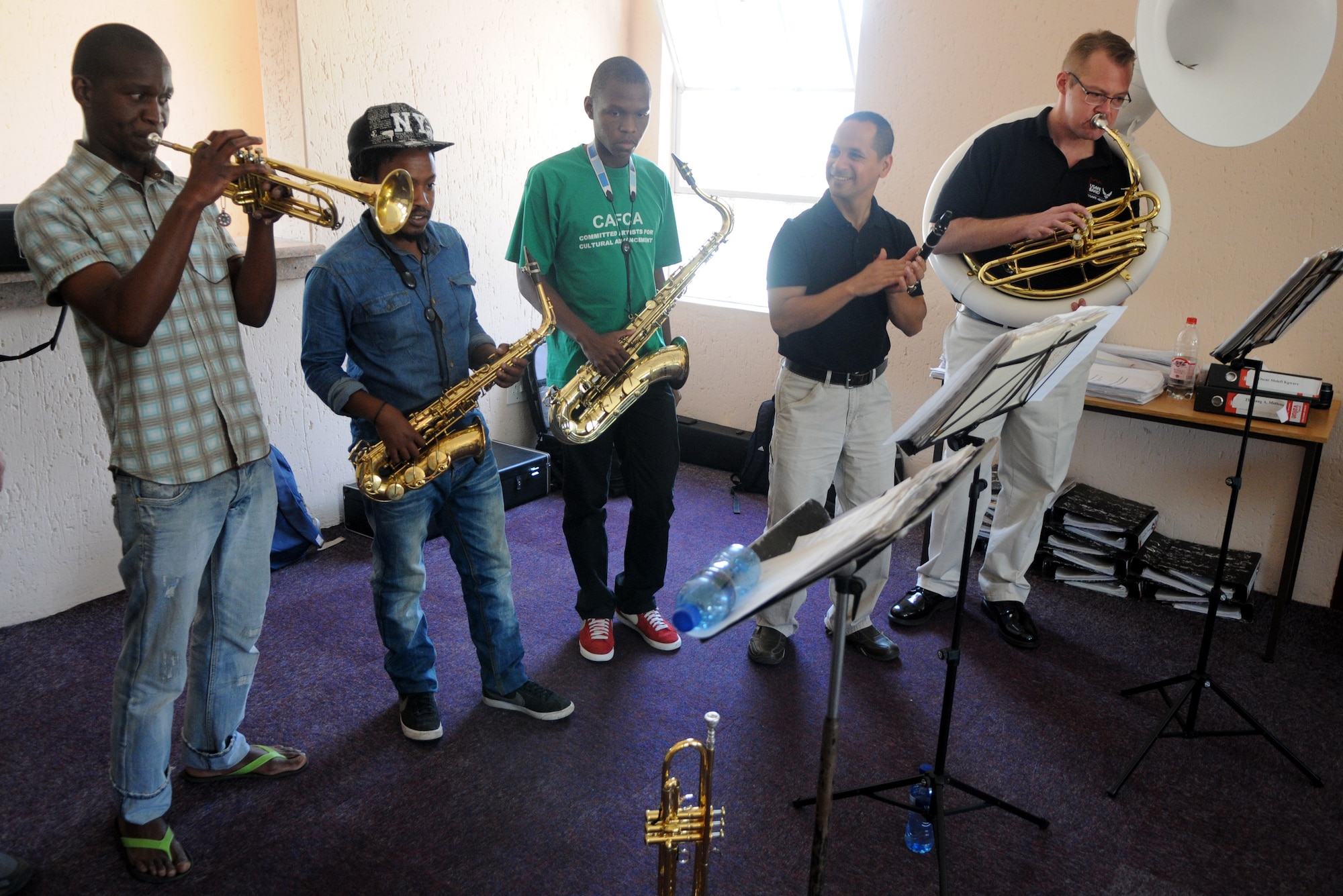 South African music students jam alongside members of the United States Air Forces in Europe jazz band, Wings of Dixie, during a jazz workshop at the Music Academy of Gauteng in Benoni, South Africa, Sept 18, 2014. Following the workshop, Wings of Dixie played a two-hour musical set featuring the musical styles of jazz, funk and blues. (U.S. Air Force photo/Tech. Sgt. Austin M. May/Released)
