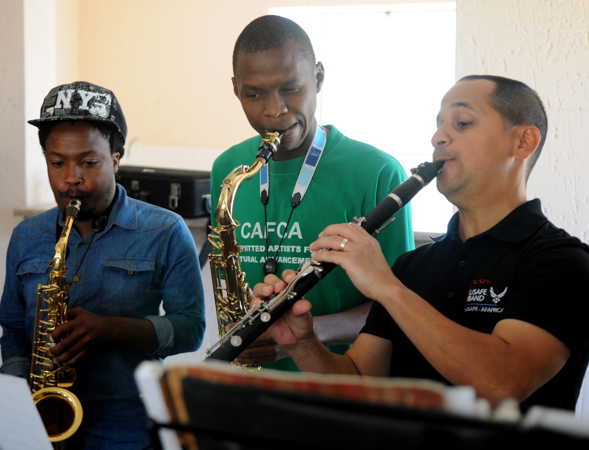 Staff Sgt. Mateo Ayala, U.S. Air Forces in Europe jazz band, Wings of Dixie clarinetist, plays with South African music students prior to a free, live concert at the Music Academy of Gauteng in Benoni, South Africa, Sept 18, 2014. Ayala and the five other members of Wings of Dixie played a two-hour musical set featuring the musical styles of jazz, funk and blues. (U.S. Air Force photo/Tech. Sgt. Austin M. May/Released)

