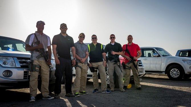 Airmen from the 386th Expeditionary Security Forces security escort team pose after a mission Aug. 6, 2014 at an undisclosed location in Southwest Asia. (U.S. Air Force photo by Staff Sgt. Jeremy Bowcock)