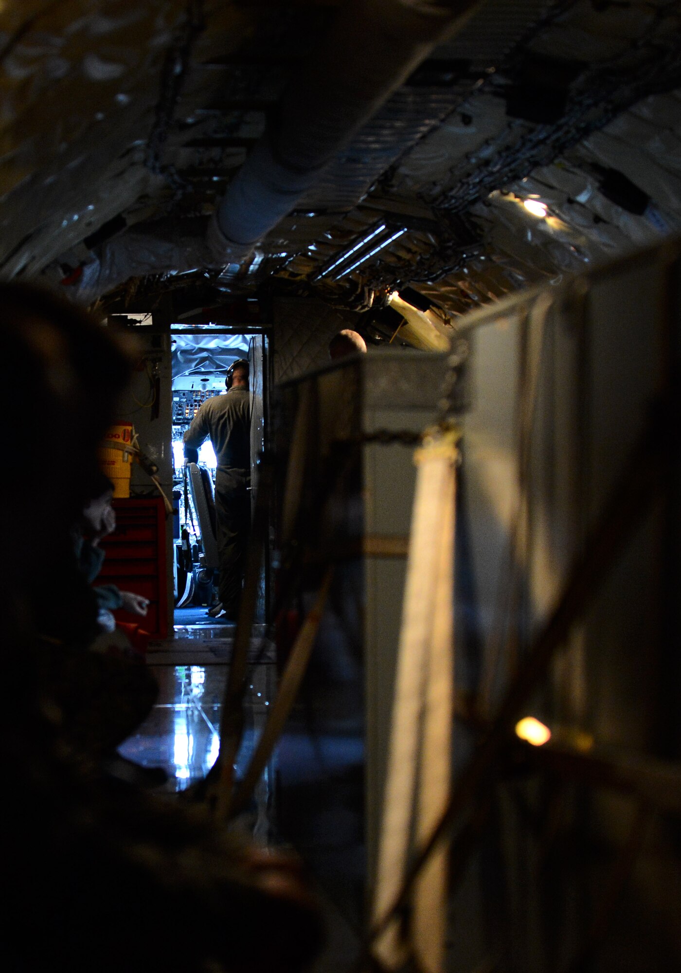 Airmen gather in a U.S. Air Force KC-135 Stratotanker before the start of a refueling aerial mission with U.S. Air Force F-16 Fighting Falcon fighter aircraft at Spangdahlem Air Base, Germany, Sept. 18, 2014. The KC-135 assigned to the 117th Air Refueling Squadron based out of Topeka, Kan., enables in-flight refueling for U.S. Air Force aircraft. (U.S. Air Force photo by Airman 1st Class Luke J. Kitterman/Released)