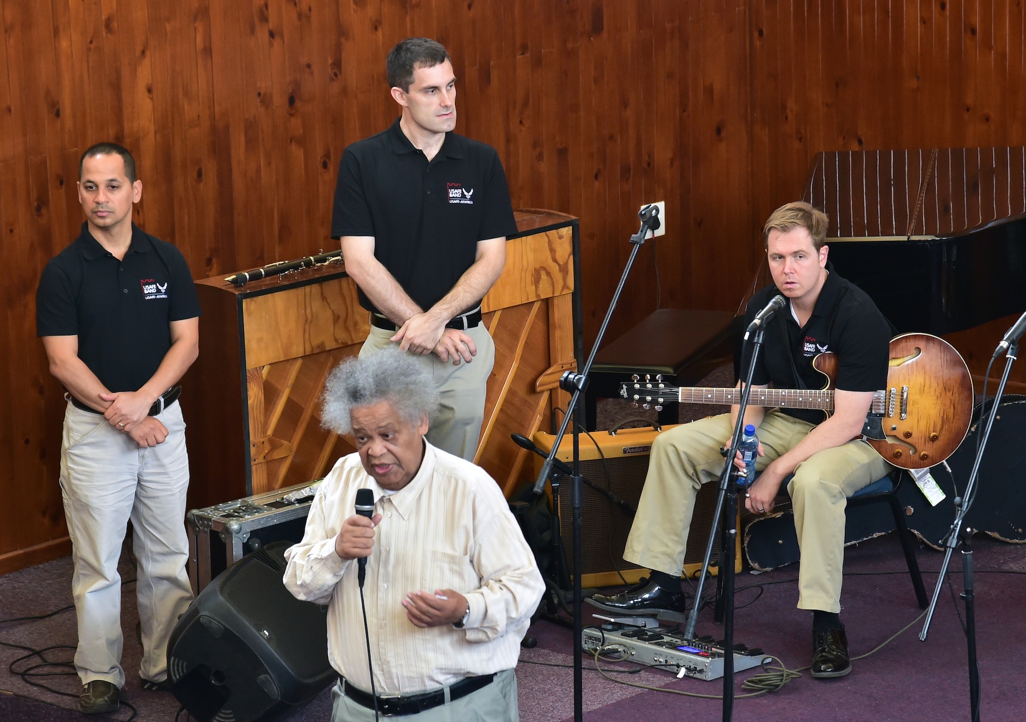 Johnny Mekoa (front), founder and director of the Music Academy of Gauteng in Benoni, South Africa gives opening remarks prior to the U.S. Air Forces in Europe jazz band, Wings of Dixie, breaking off into four separate working groups teach their respective musical skills Sept 18, 2014. In addition to teaching the musical workshop, the jazz band played a free, live concert for nearly 150 music students.  (U.S. Air Force photo/Staff Sgt. Travis Edwards-Released)