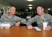 Air Force Master Sgt. James Nielsen listens to Air Force Senior Airman Erik Winter discuss goals for his mentorship program at the 380th Air Expeditionary Wing’s Oasis Dining Facility August 23. The two are participating in the wing’s “Adopt an Airman” program on base at an undisclosed location in Southwest Asia. (U.S. Air National Guard photo by Senior Master Sgt. Eric Peterson/Released)

