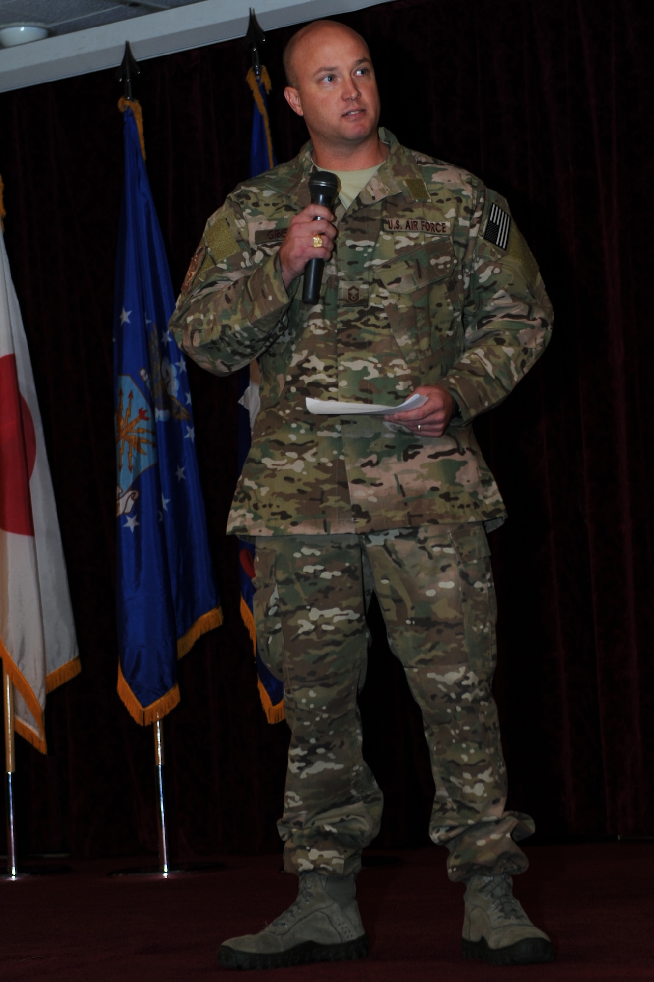 U.S. Air Force Senior Master Sgt. Bradford Greisen, 320th Special Tactics Squadron operations superintendent, speaks about his experiences in observance of National Prisoner of War and Missing in Action Recognition Day on Kadena Air Base, Japan, Sept. 19, 2014. Greisen spoke about the importance of teamwork and shared stories of heroic individuals who were imprisoned by enemy forces or who never made it home. (U.S. Air Force photo by Airman 1st Class Zade C. Vadnais/Released)