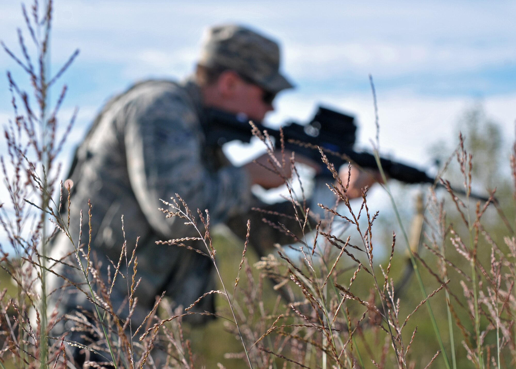 Airman 1st Class Troy Baker, 8th Security Forces Squadron response force member, prepares to shoot an M4 rifle during combat readiness training Sept. 16 at Kunsan Air Base, Republic of Korea. Over the course of three days, Airmen covered topics including mounted and dismounted operations, individual and small unit tactics, land navigation, shoot-move and communication, tactical communications, enemy prisoner of war procedures, self-aid buddy care and additional Battlefield curriculums. (U.S. Air Force photo/Senior Airman Katrina Heikkinen)