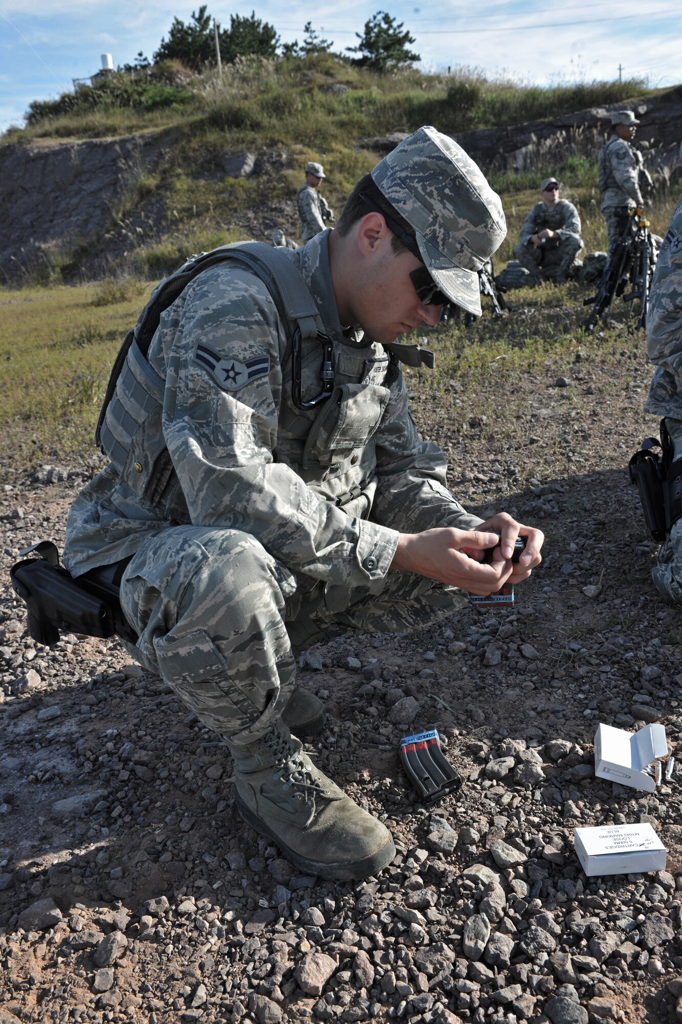 Airman 1st Class Zachary Hunter, 8th Security Forces Squadron response force member, puts blank ammunition rounds into a magazine Sept. 16 during combat readiness training at Kunsan Air Base, Republic of Korea. As part of the three-day training, security forces members re-qualified on their M4 rifle, a sustainment requirement for all security forces members. (U.S. Air Force photo/Senior Airman Katrina Heikkinen)