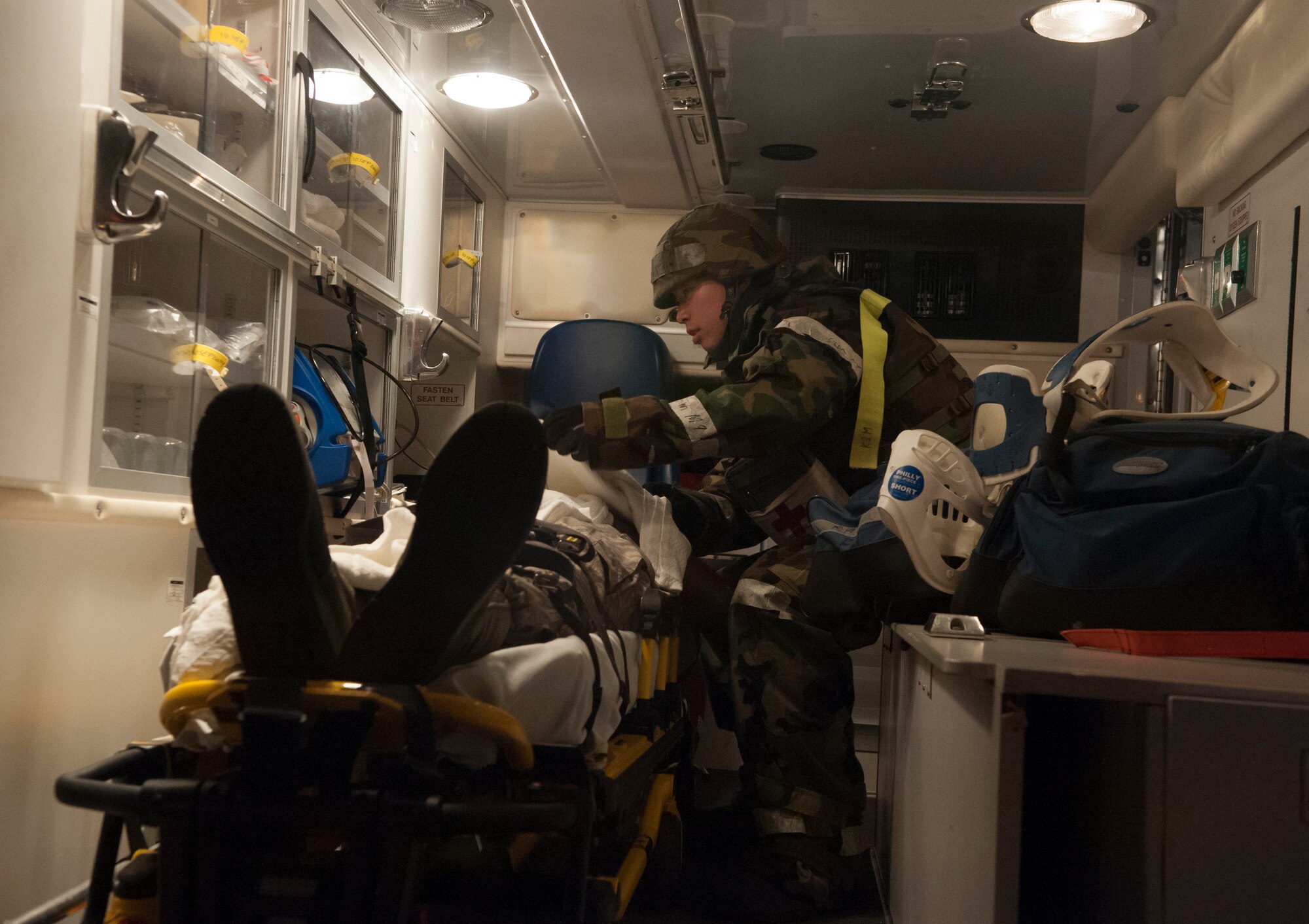 A medic from the 51st Medical Group treats a wounded victim during a mass casualty exercise at Osan Air Base, Republic of Korea, Sept.17, 2014. Osan participates in these exercises so Airmen can demonstrate their ability to perform in heightened awareness situations. (U.S. Air Force photo by Senior Airman Matthew Lancaster)
