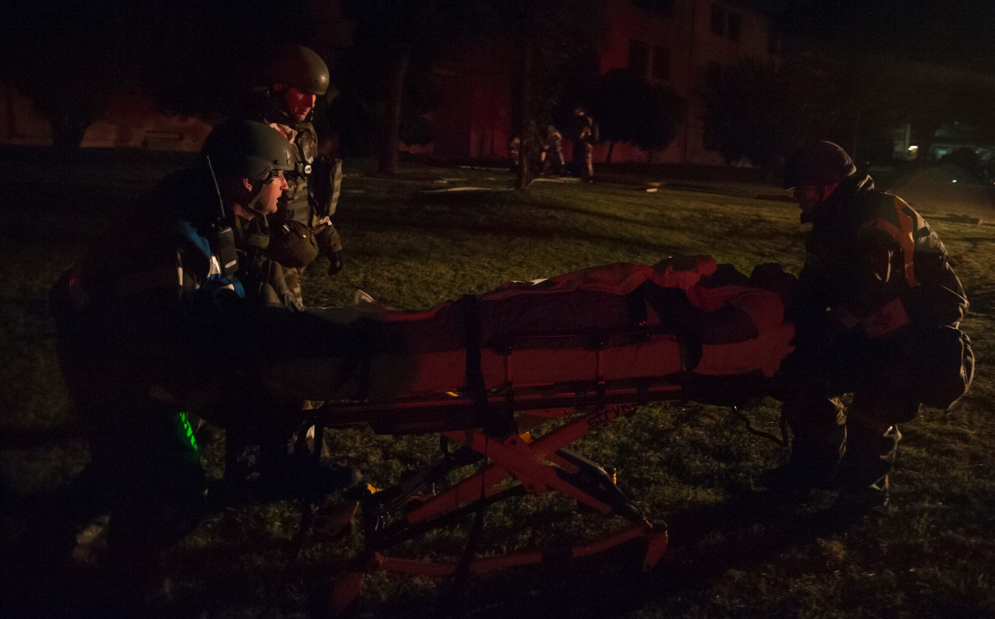 Medics from the 51st Medical Group transport a wounded victim during a mass casualty exercise at Osan Air Base, Republic of Korea, Sept.17, 2014. Osan Airmen participate in OREs to maintain proficiency for wartime conditions. (U.S. Air Force photo by Senior Airman Matthew Lancaster)