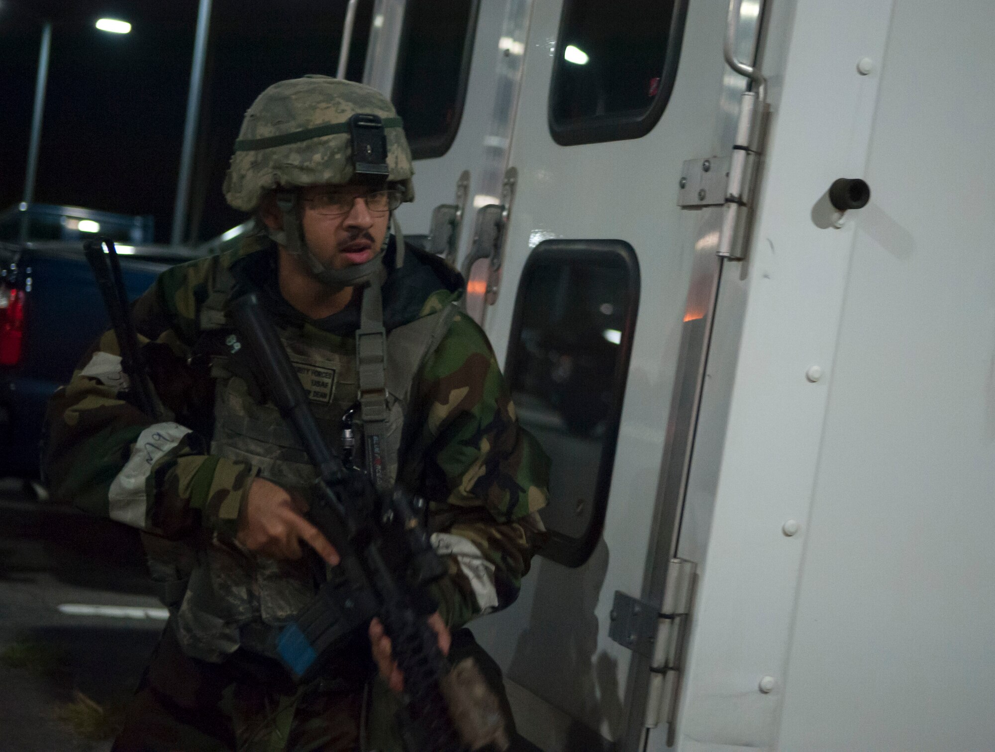 A 51st Security Forces Squadron member engages in a fire fight with opposition forces during Operational Readiness Exercise Beverly Midnight 14-4 Sept. 17, 2014, at Osan Air Base, Republic of Korea. During the exercise scenario, 51st SFS members defended the 51st Fighter Wing headquarters. (U.S. Air Force photo by Senior Airman Matthew Lancaster)