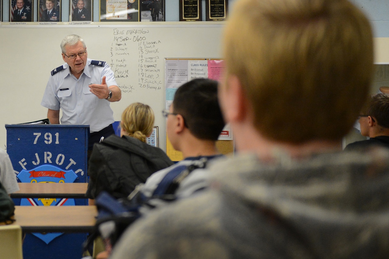 Retired Air Force Col. Charles Marriott, Junior ROTC senior aerospace science instructor at McDowell High School in Erie, Pa., interacts with students Sept. 5, 2014. Marriott met, taught and mentored Navy Petty Officer 1st Class Jason Thompson during Junior ROTC classes and continues to be a supporter and mentor for the sailor, who has battled suicidal ideations. DoD photo by Marvin Lynchard