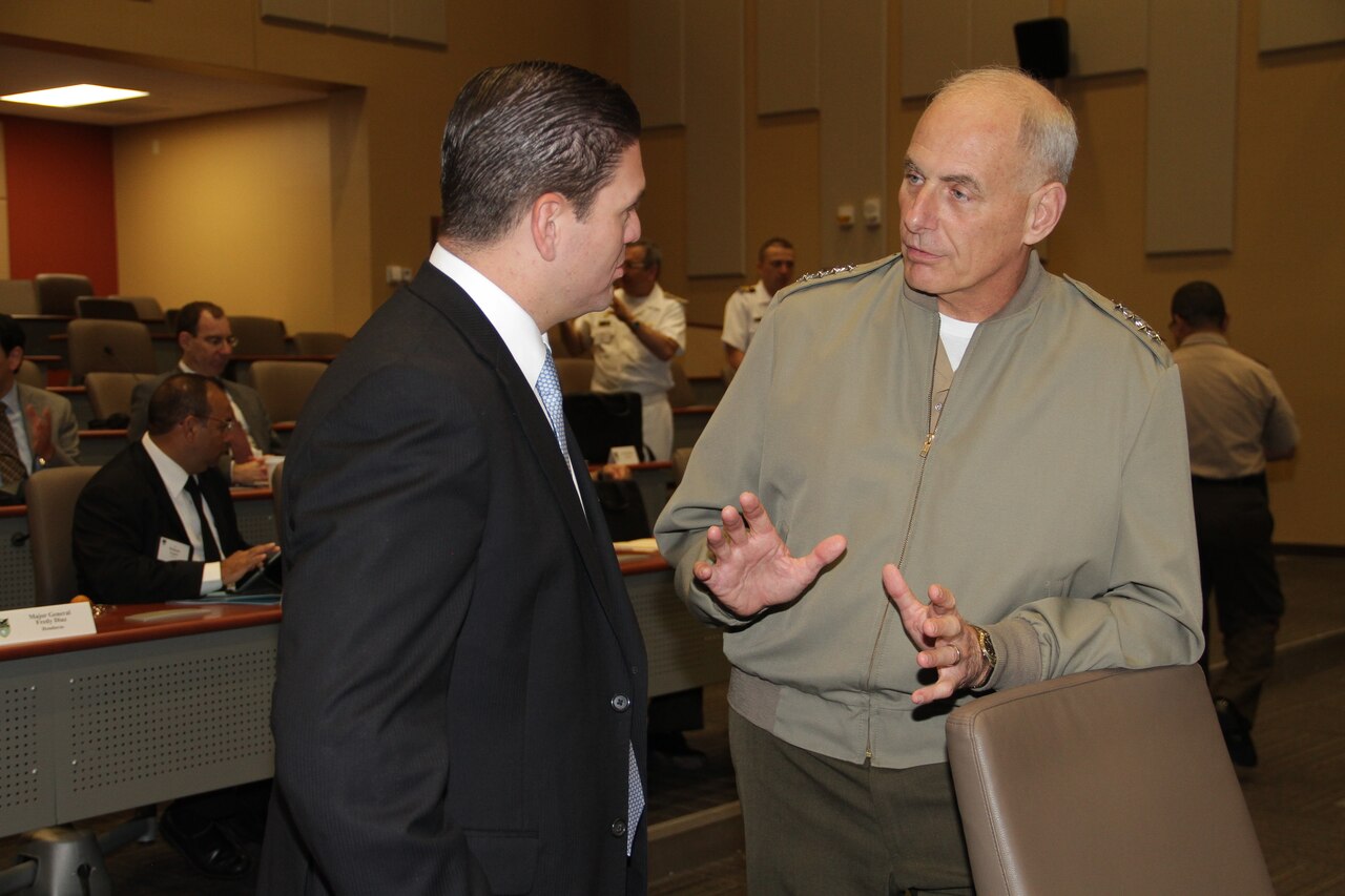 Marine Corps Gen. John F. Kelly, commander of U.S. Southern Command, speaks with Colombian Defense Minister Juan Carlos Pinzon before the start of a regional security workshop at Southcom headquarters in Miami, Sept. 18, 2014. Defense and public security ministers from Belize, Colombia, Costa Rica, El Salvador, Guatemala, Honduras, Mexico and Panama discussed approaches to security challenges in Central America. Southcom photo by Jose Ruiz