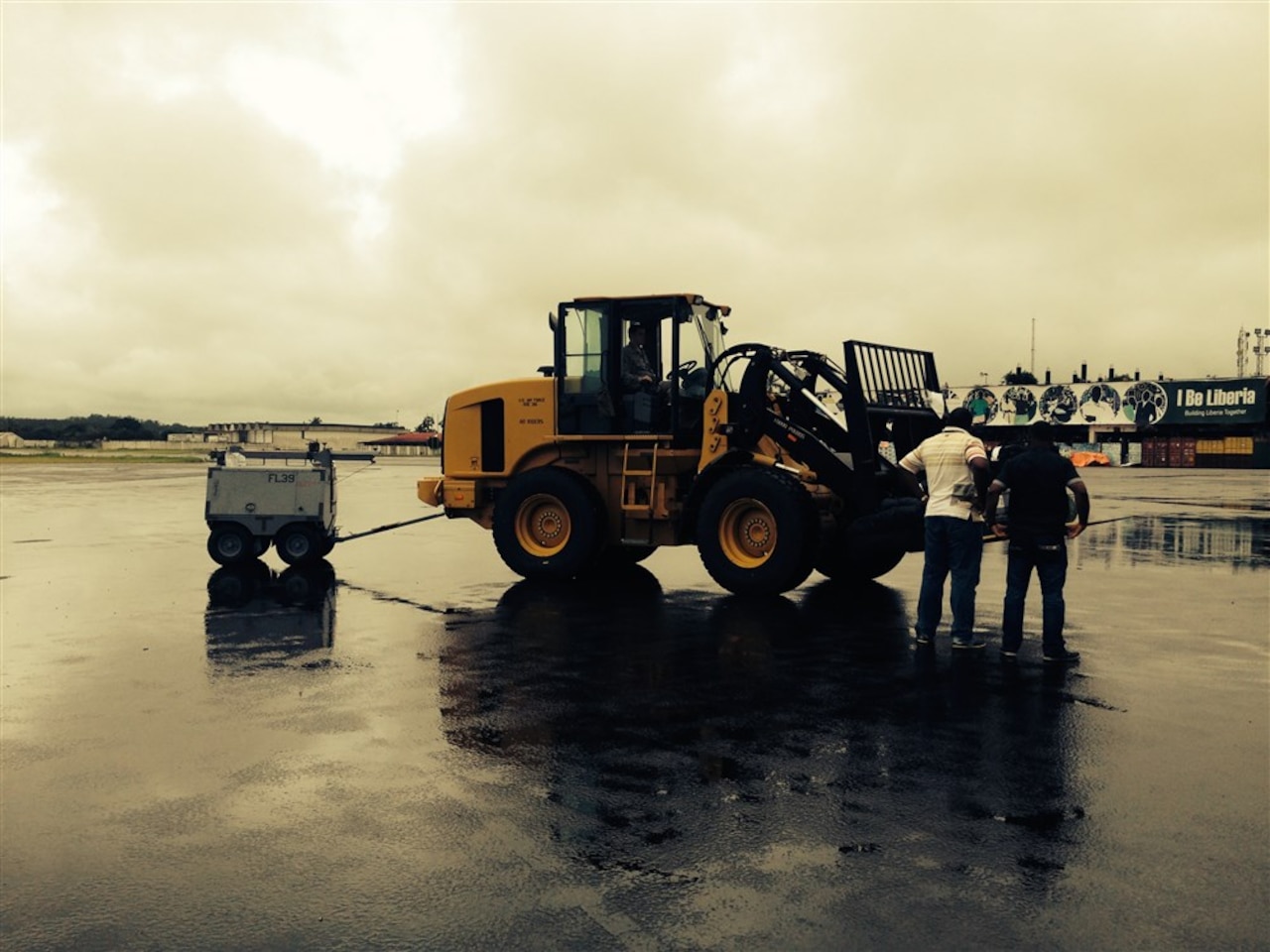 The first shipment of the ramped-up military response to Ebola arrives in Liberia, Sept. 18, 2014. The cargo included a heavy-duty forklift, a drill set and generator, and a team of seven military personnel, including engineers and airfield specialists. The forklift will be used to offload incoming supplies. State Department photo