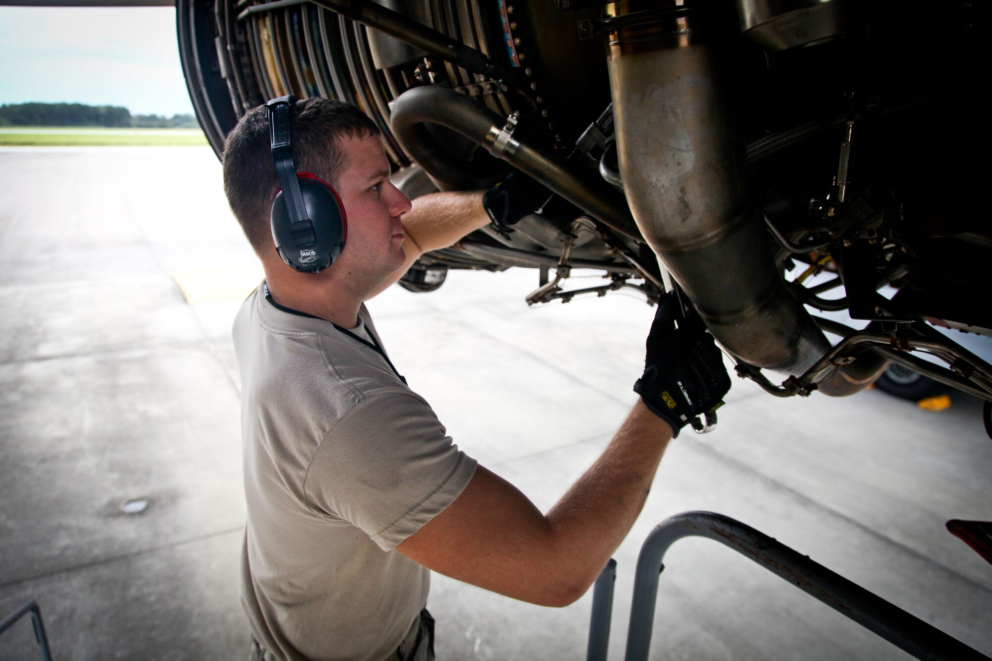 Senior Airman Andrew Robinson, an 315th Aircraft Maintenance Squadron member, installs a spark plug into a C-17 Globemaster III engine yesterday on the flightline here at Joint Base Charleston, S.C. Robinson provided maintenance support along with other 315th MXG members yesterday while the 437th Maintenance Group took part in the active duty’s wingman day activities. (U.S. Air Force photo by Staff Sgt. Rashard Coaxum)