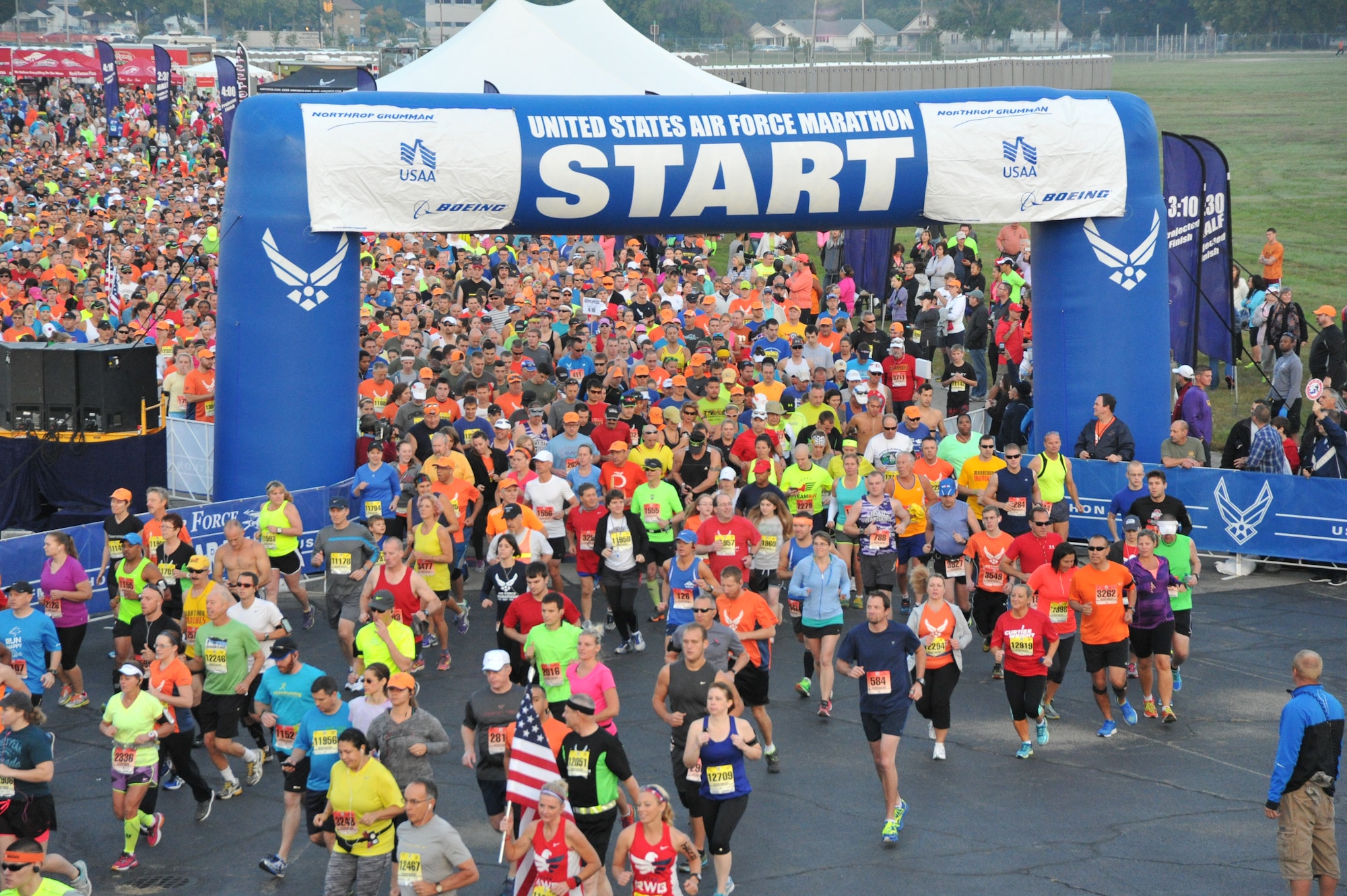 Runners take off from the starting line of the 2014 U.S, Air Force Marathon, Wright-Patterson Air Force Base, Ohio, Sept. 20. The race set an attendance record again this year with approximately 15,000 runners. (U.S. Air Force photo by Mike Libecap)