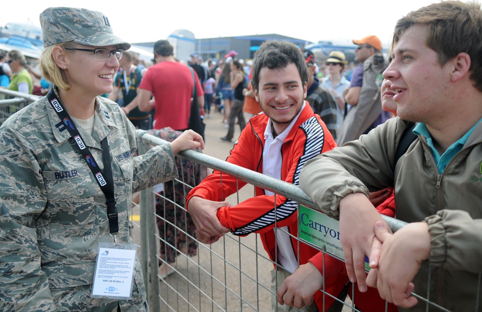 Capt. Danielle Butler, physician assistant, answers Air Force-related questions for guests at Africa's largest air show Sept. 20, 2014. Griffith and a total force team of U.S. Air Force Airmen and U.S. Army Soldiers attended the Africa Aerospace & Defence Expo 2014 at Waterkloof Air Force Base, South Africa, to showcase the United States' commitment to its partnership with South Africa. (U.S. Air Force photo by Tech. Sgt. Austin M. May/Released)