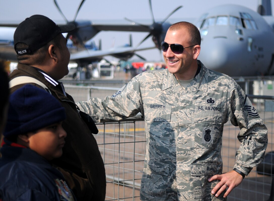 Master Sgt. Jeff Griffith discusses military police operations to guests at Africa's largest air show Sept. 20, 2014. Griffith and a total force team of U.S. Air Force Airmen and U.S. Army Soldiers attended the Africa Aerospace & Defence Expo 2014 at Waterkloof Air Force Base, South Africa, to showcase the United States' commitment to its partnership with South Africa. (U.S. Air Force photo by Tech. Sgt. Austin M. May/Released)