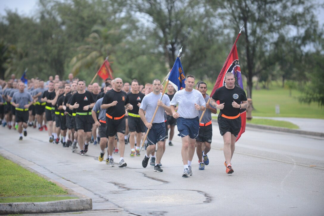 Brig. Gen. Andrew J. Toth,  36th Wing commander ,(left) and Lt. Col. Clyde Cochrane, U.S. Army Task Force Talon commander, lead the Task Force Talon 5K Sept 10, 2014, on Andersen Air Force Base, Guam. The Task Force Talon 5K was a joint physical training session. (U.S. Air Force photo by Airman 1st Class Adarius Petty/Released)