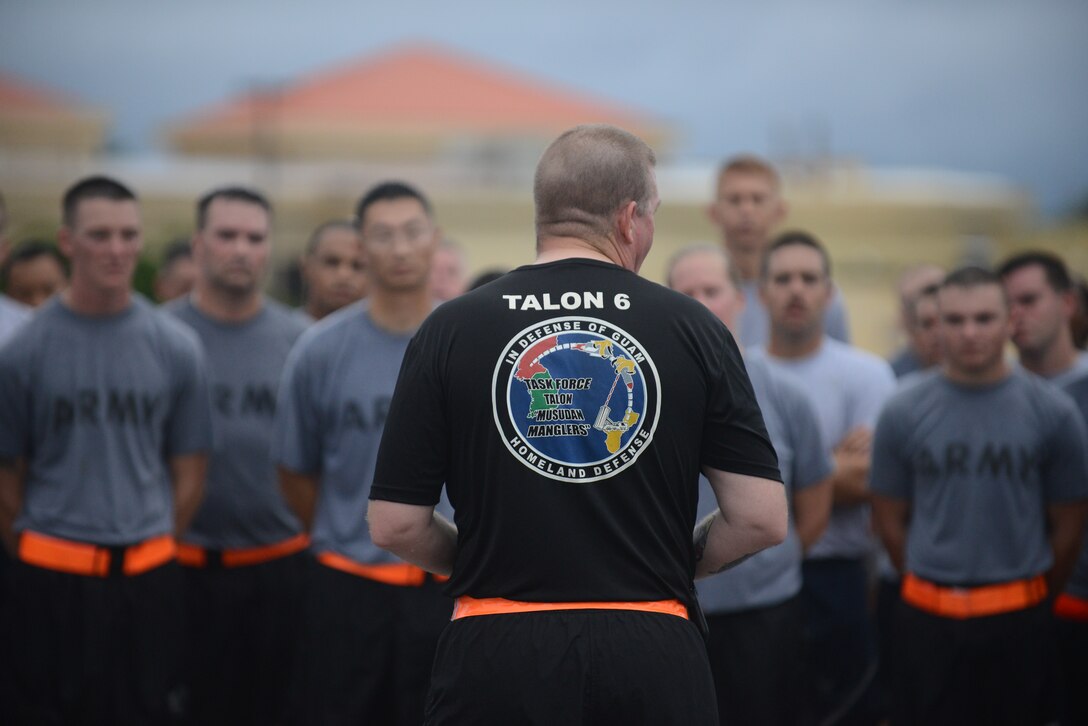 Lt. Col. Clyde Cochrane, Task Force Talon commander speaks to soldiers after their morning run Sept 10, 2014, on Andersen Air Force Base, Guam. Cochrane spoke on the importance of remembering 9/11 and those that made the ultimate sacrifice.  (U.S. Air Force photo by Airman 1st Class Adarius Petty/Released) 