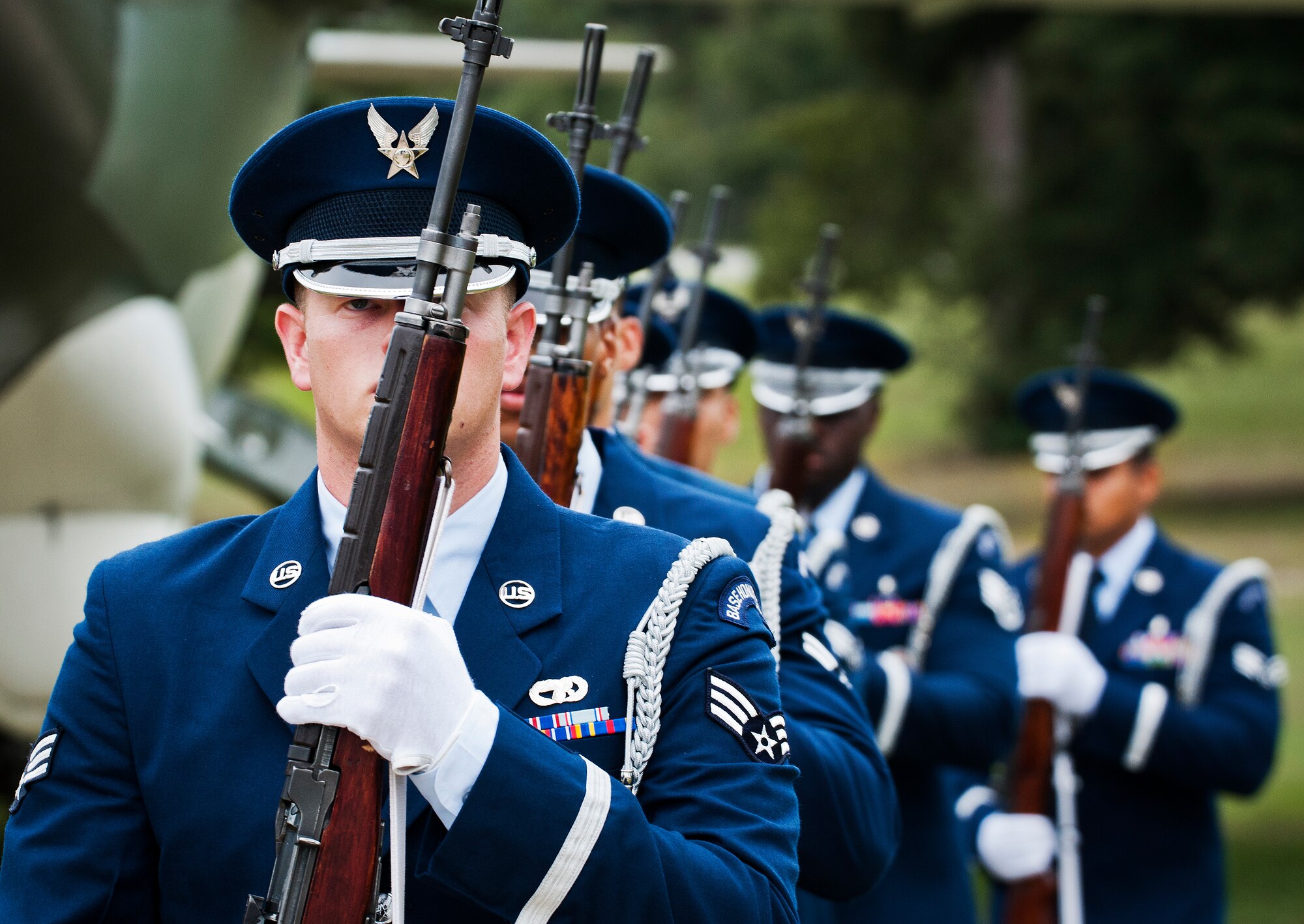 A Team Eglin Honor Guard rifle volley team marches away after the base's POW/MIA remembrance ceremony Sept. 19 at the Air Force Armament Museum. The ceremony paid tribute to those military members who have yet to return home from defending America. The event featured tributes, guest speakers and honor guard procedures. (U.S. Air Force photo/Samuel King Jr.)