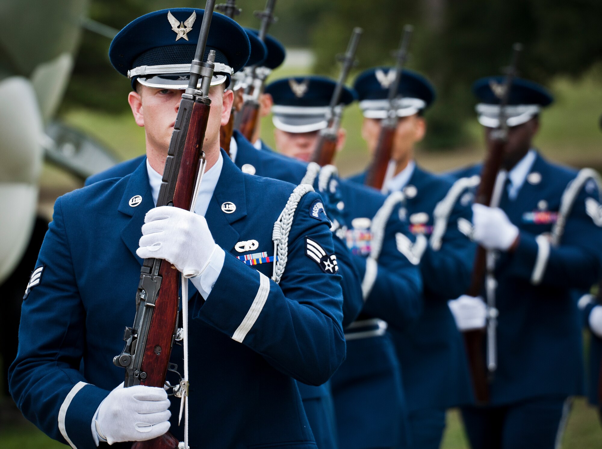 A Team Eglin Honor Guard rifle volley team marches away after the base's POW/MIA remembrance ceremony Sept. 19 at the Air Force Armament Museum. The ceremony paid tribute to those military members who have yet to return home from defending America. The event featured tributes, guest speakers and honor guard procedures. (U.S. Air Force photo/Samuel King Jr.)