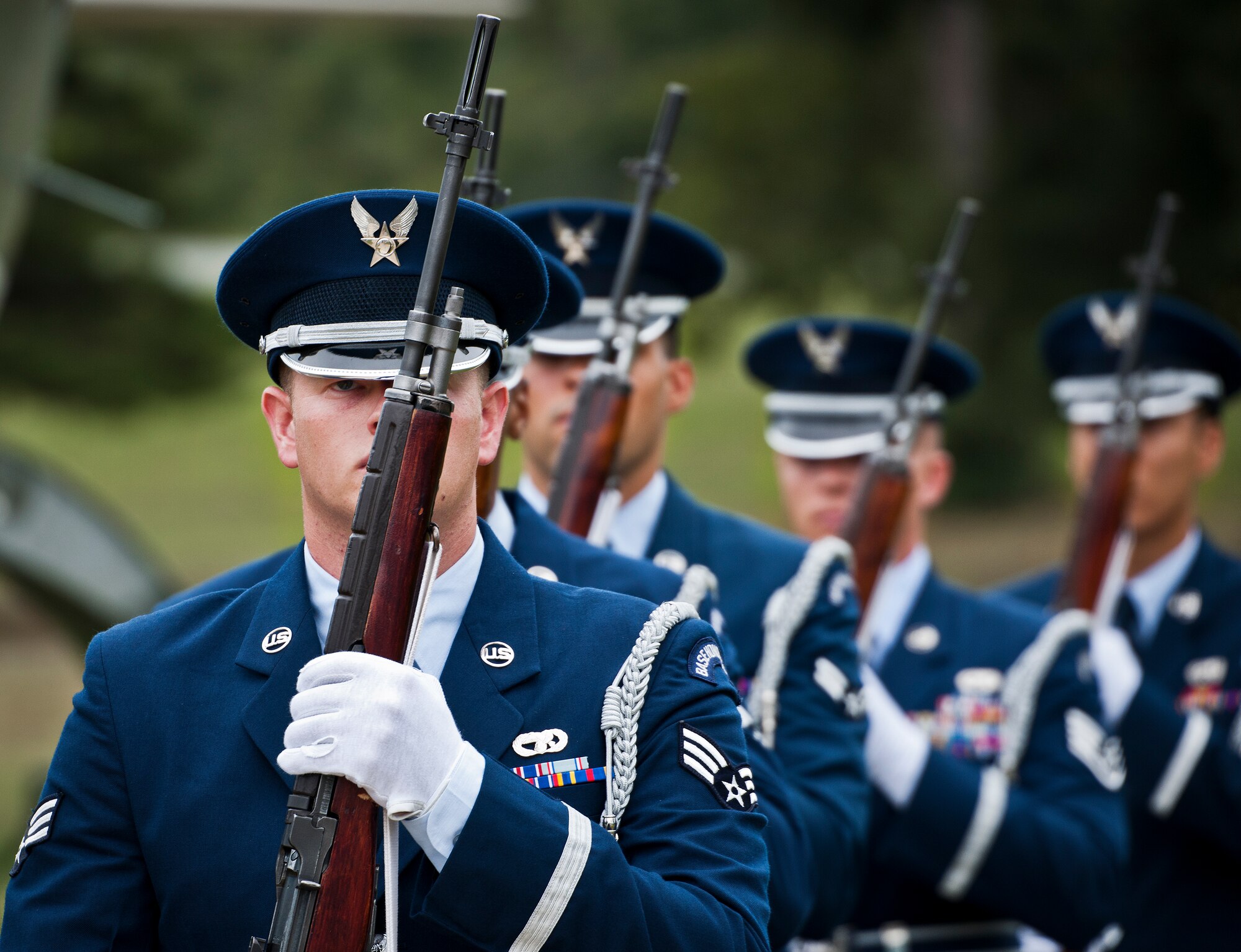A Team Eglin Honor Guard rifle volley team marches away after Eglin’s POW/MIA remembrance ceremony Sept. 19 at the Air Force Armament Museum. The ceremony paid tribute to those military members who have yet to return home from defending America. The event featured tributes, guest speakers and honor guard procedures. (U.S. Air Force photo/Samuel King Jr.)