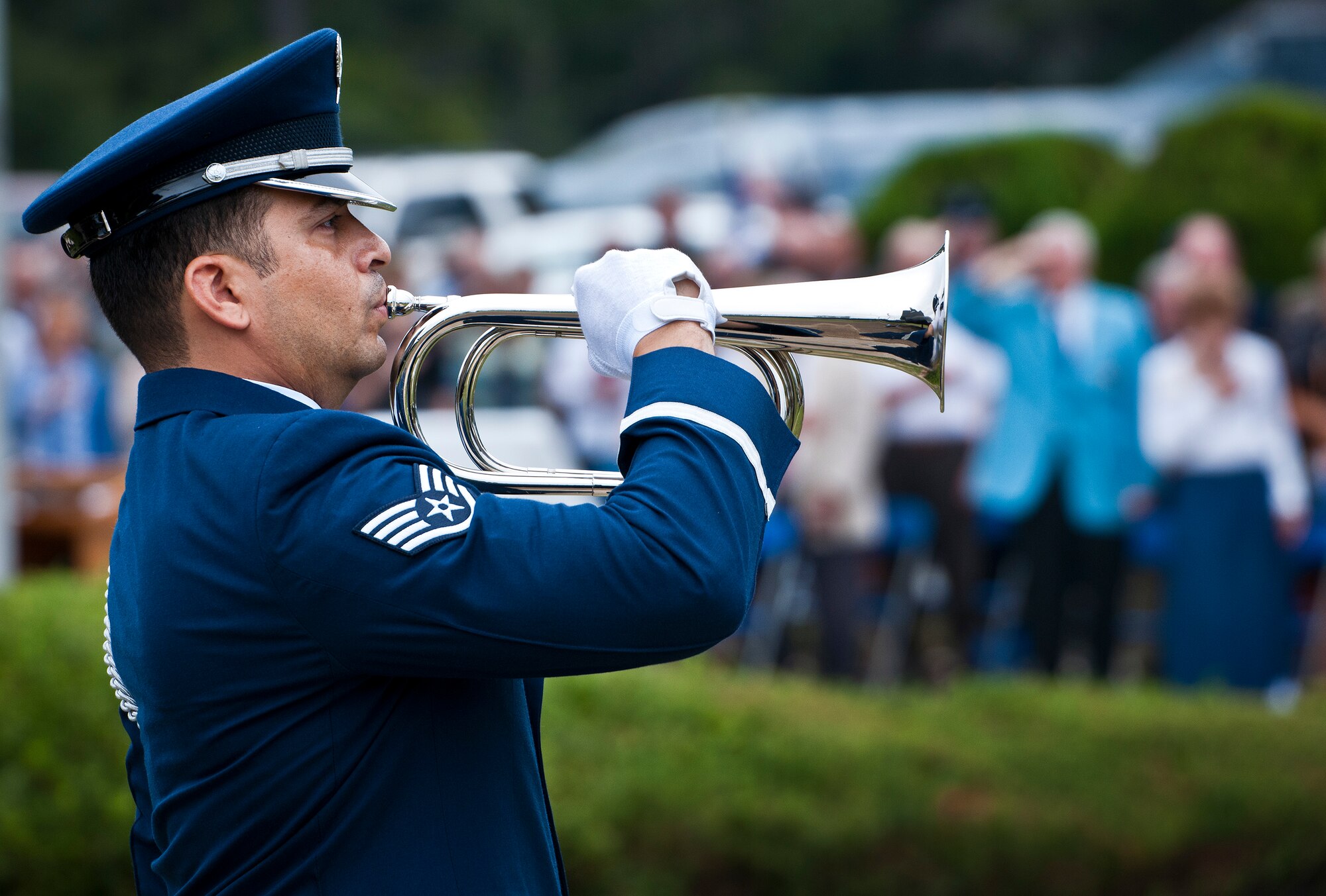 An Eglin Honor Guard bugler plays taps during the base’s POW/MIA remembrance ceremony Sept. 19 at the Air Force Armament Museum. The ceremony paid tribute to those military members who have yet to return home from defending America. The event featured tributes, guest speakers and honor guard procedures. (U.S. Air Force photo/Samuel King Jr.)