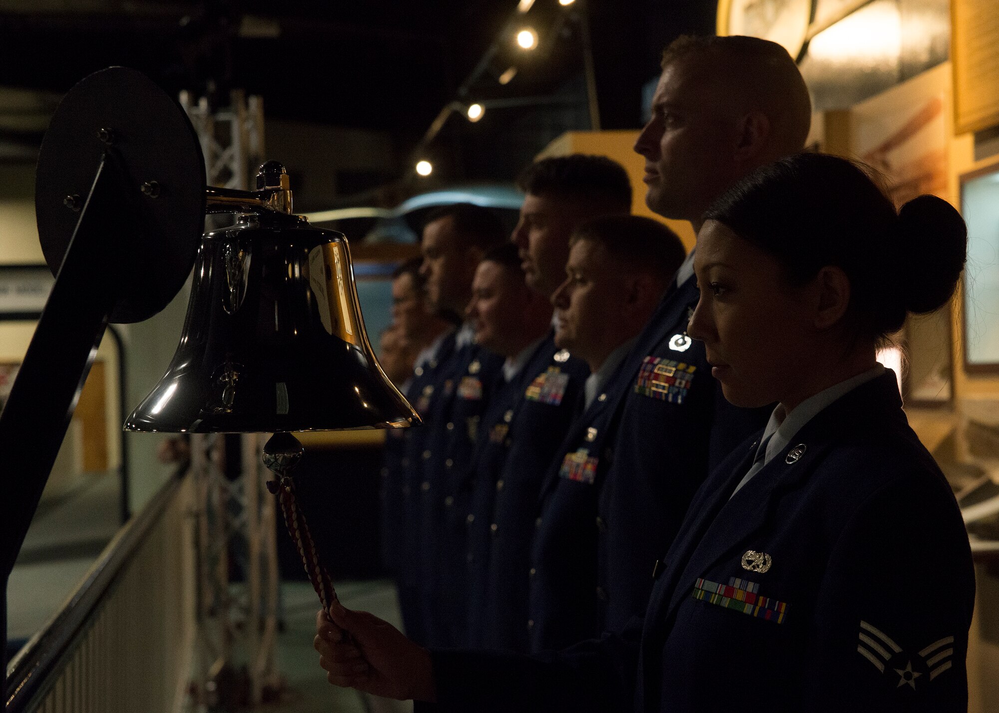 Senior Airman Lita Burnett, 96th Maintenance Squadron, stands ready to ring the bell during Eglin’s POW/MIA ceremony Sept. 19 at the Air Force Armament Museum. The ceremony paid tribute to those military members who have yet to return home from defending America. The event featured tributes, guest speakers and honor guard procedures. (U.S. Air Force photo/Tech. Sgt. Jasmin Taylor)