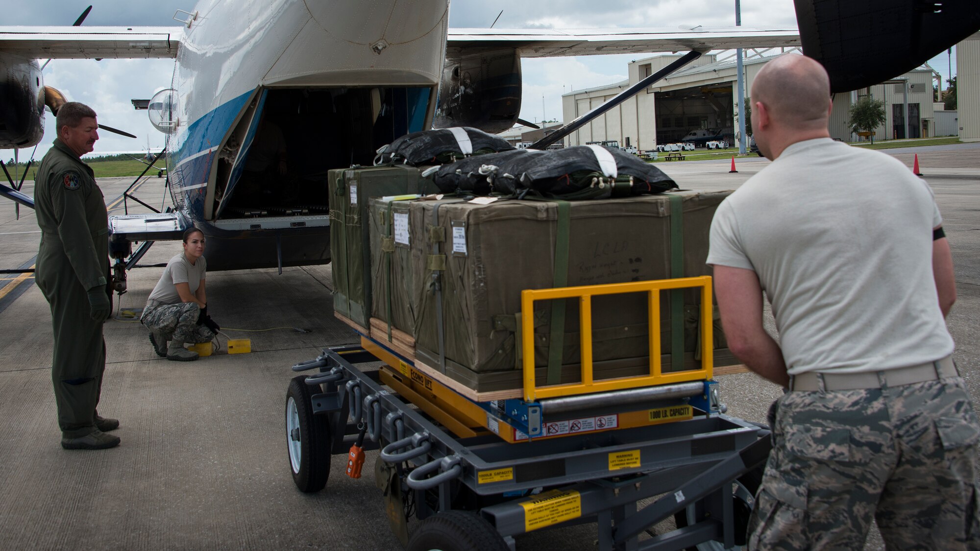 Members from the 919th Special Operations Logistics Readiness Squadron, load three low cost low altitude airdrop bundles into a C-145 Sept. 15, at Duke Field, Fla. The Airmen of the SOLRS prepare and load an average of 24 to 48 loads per week to help train pilots and loadmasters from the 5th, 6th, and the 711th Special Operations Squadron. (Air Force photo/Tech. Sgt. Jasmin Taylor)